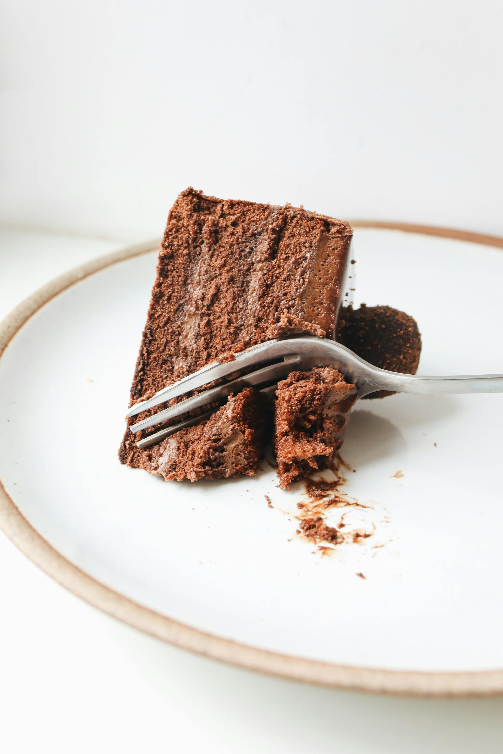 A slice of chocolate cake on a plate | Source: Pexels