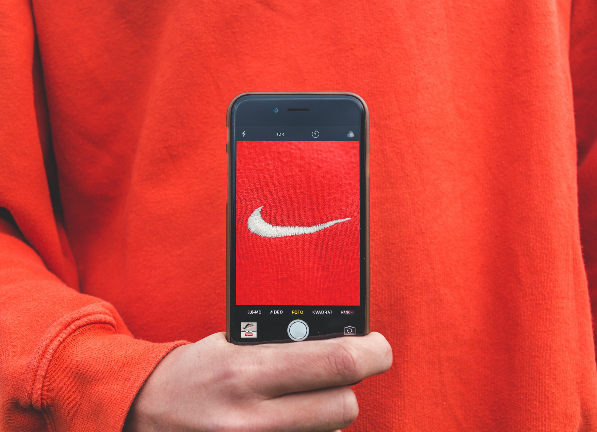 Red Nike Sweater | Source: Unsplash