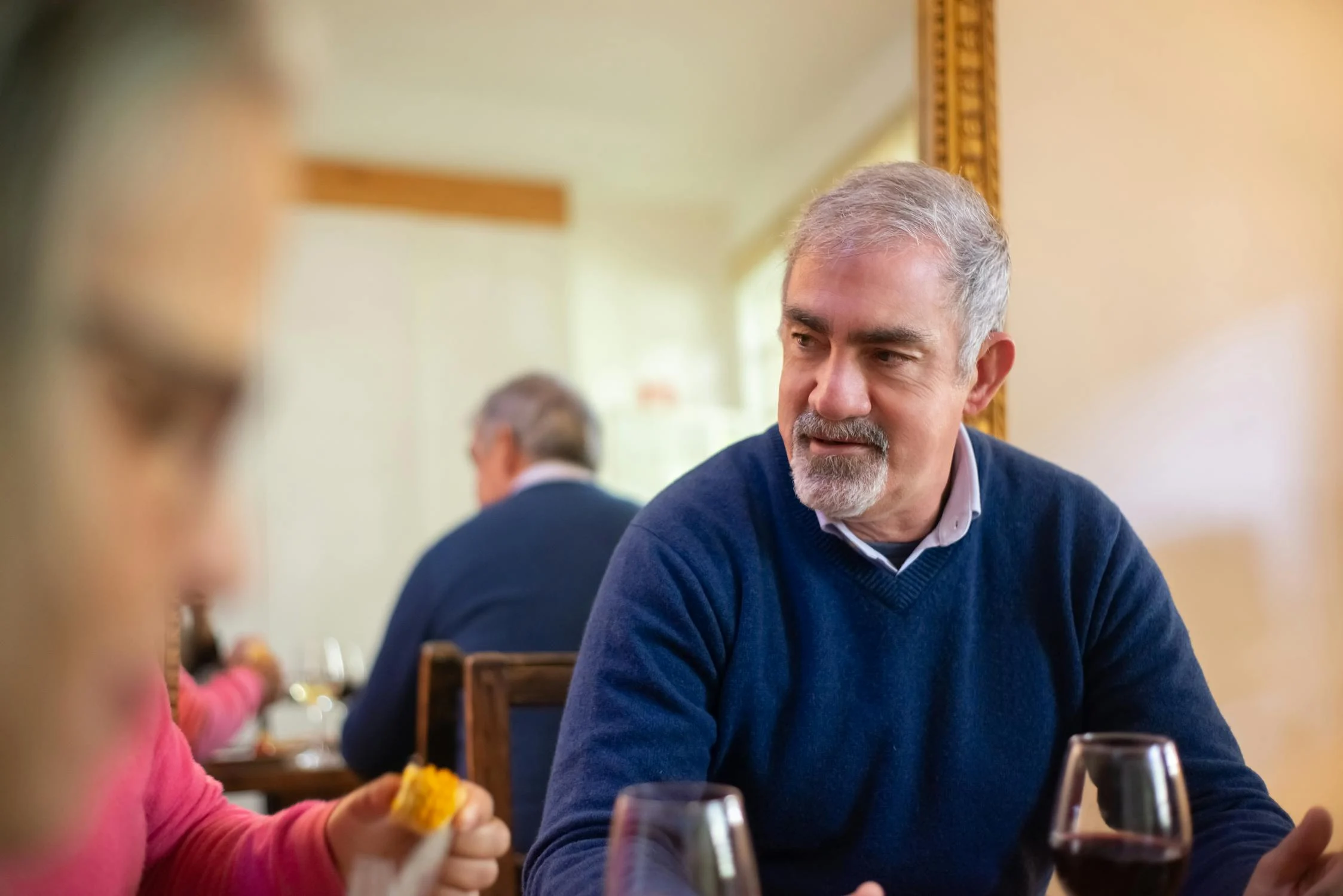 A middle-aged man frowning during dinner | Source: Pexels