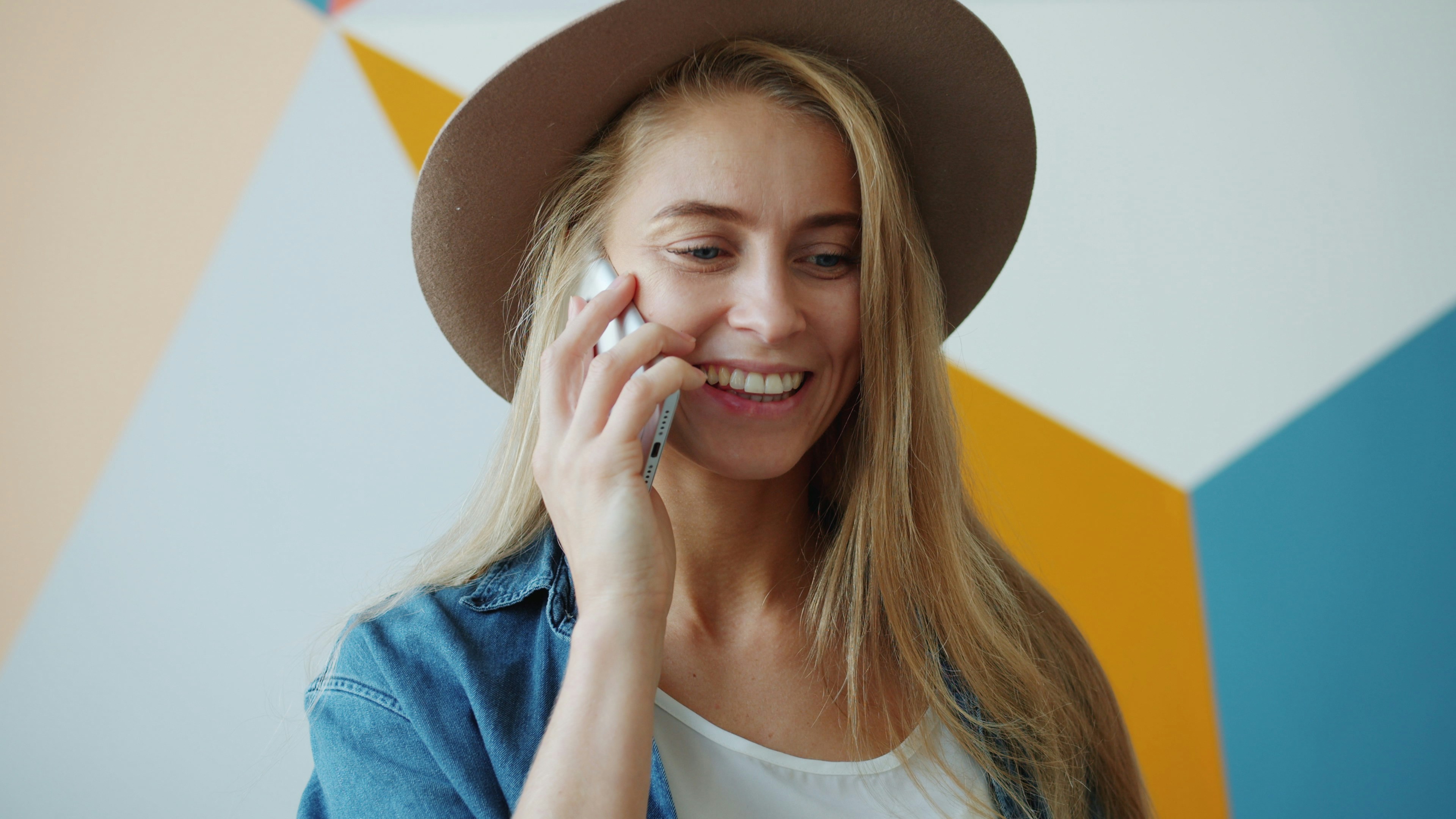 A very happy woman on a call | Source: Unsplash