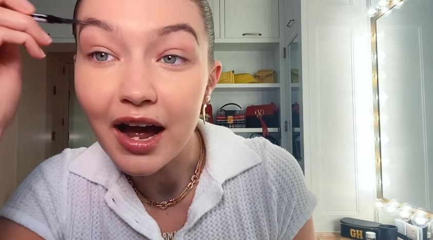 Gigi Hadid doing her makeup routine from a video dated February 4, 2021. | Source: YouTube/Vogue