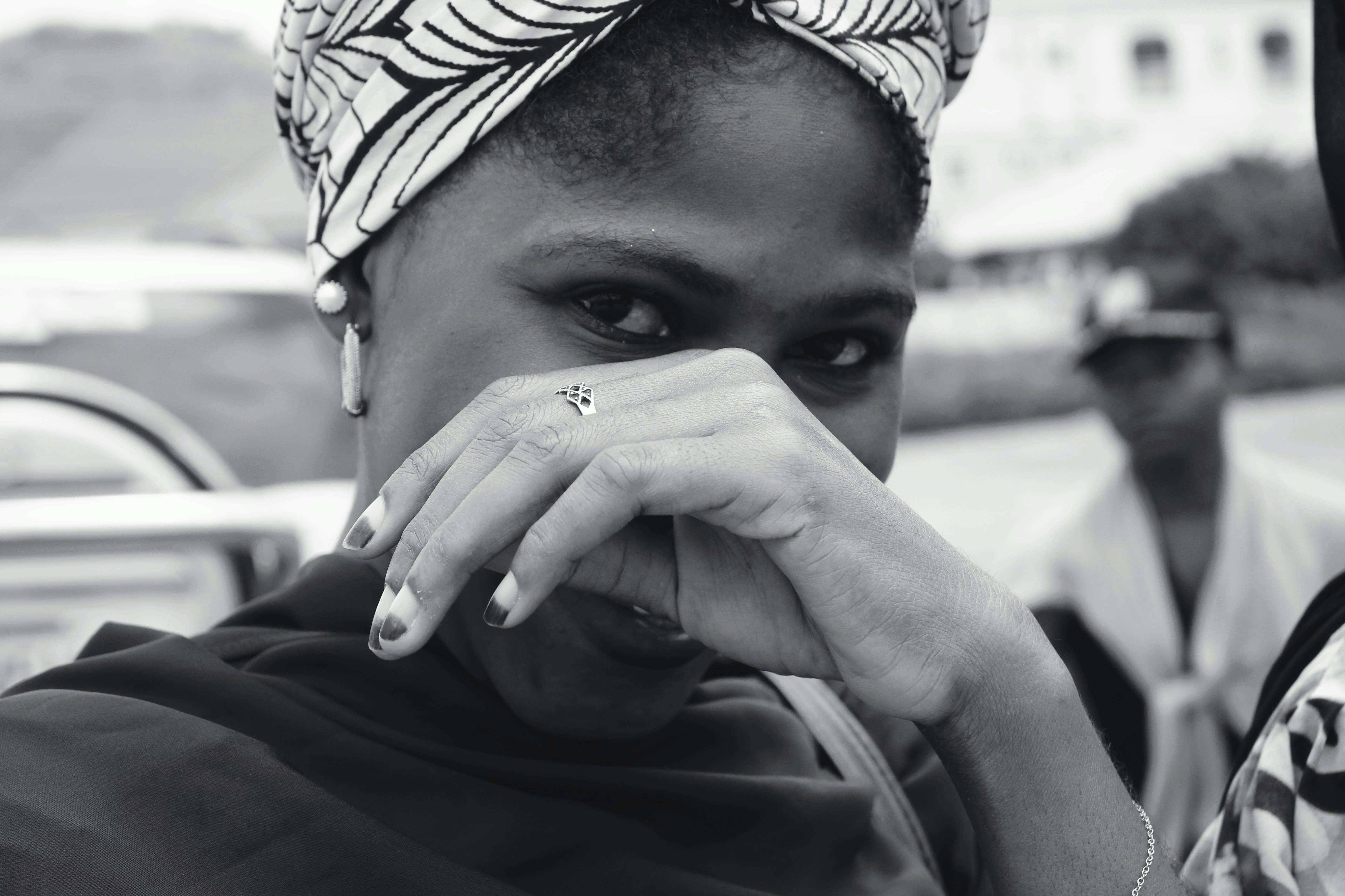 A woman covering her face | Source: Unsplash