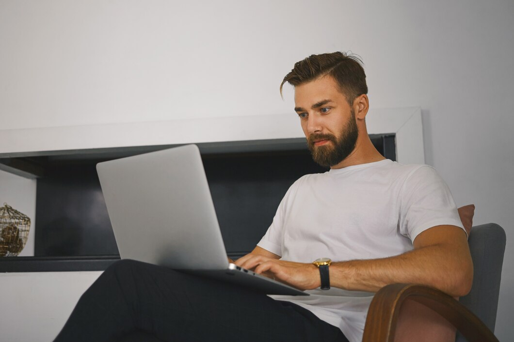 A man on his laptop | Source: Freepik