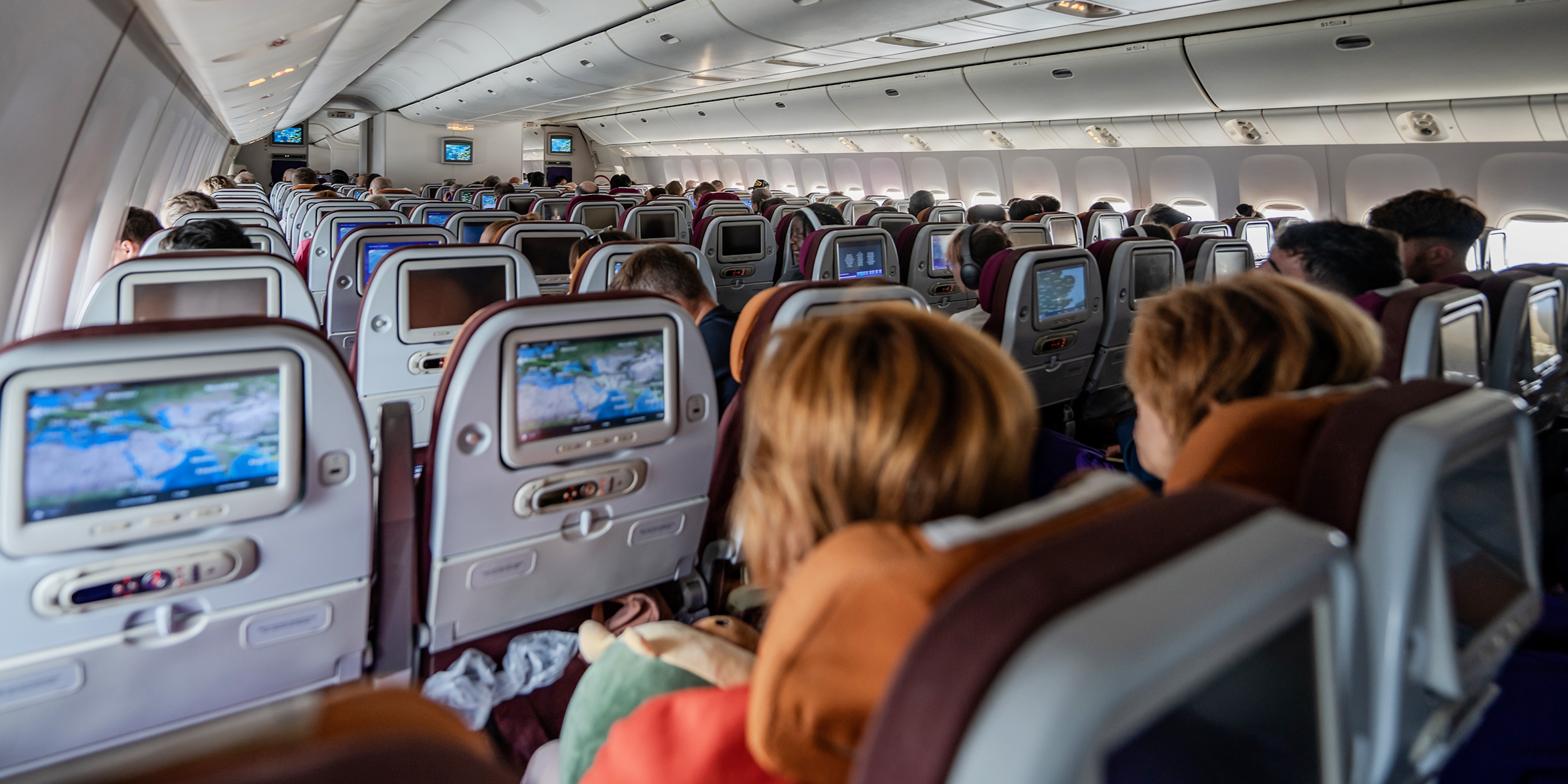 Passengers on an airplane | Source: Shutterstock