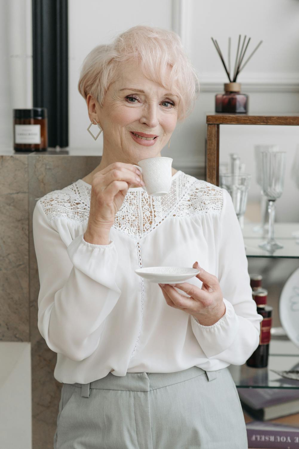 A smug woman drinking her coffee | Source: Pexels