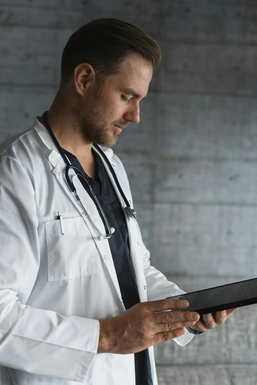 A doctor looking at his notes | Source: Pexels