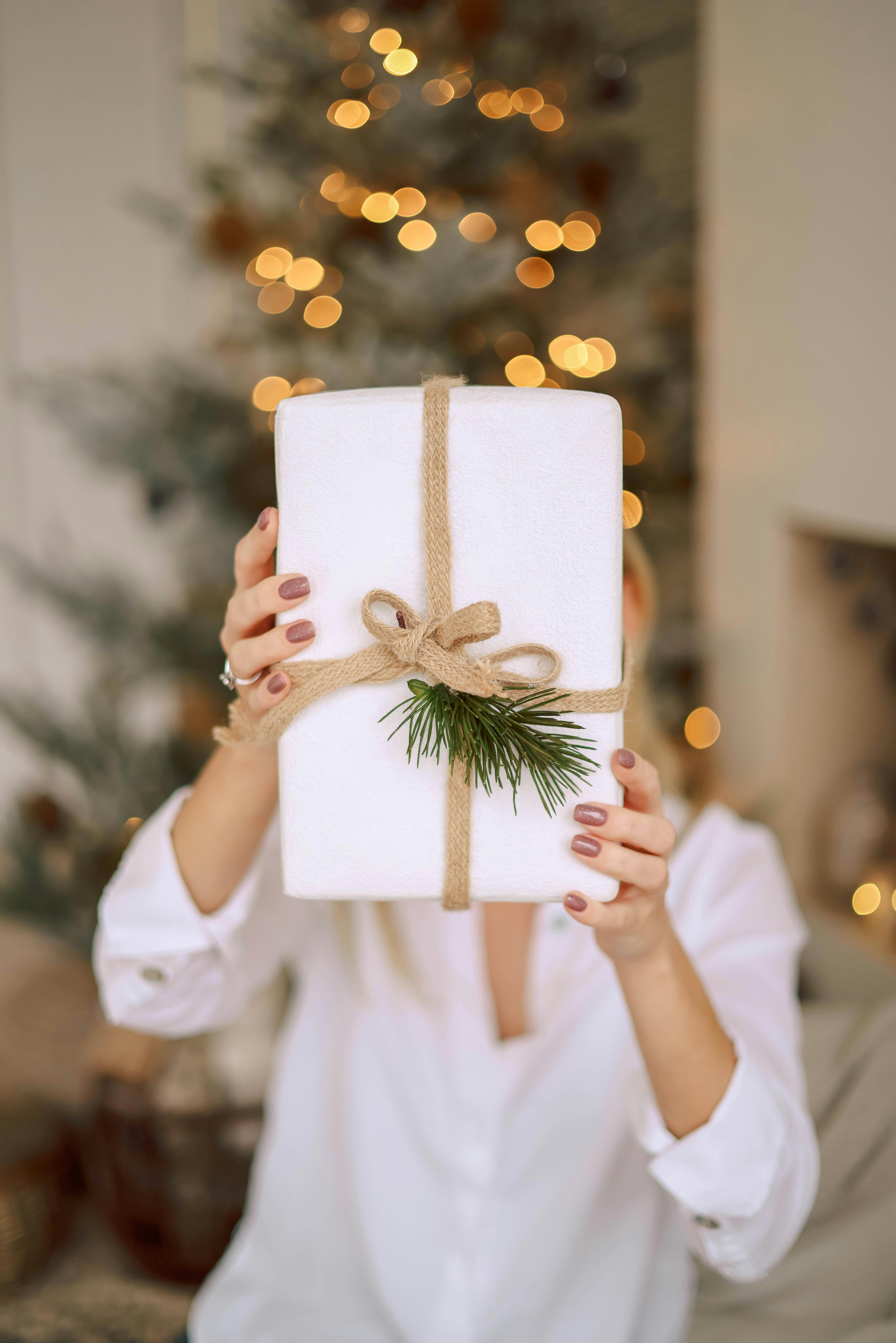 A woman holding out a gift | Source: Pexels
