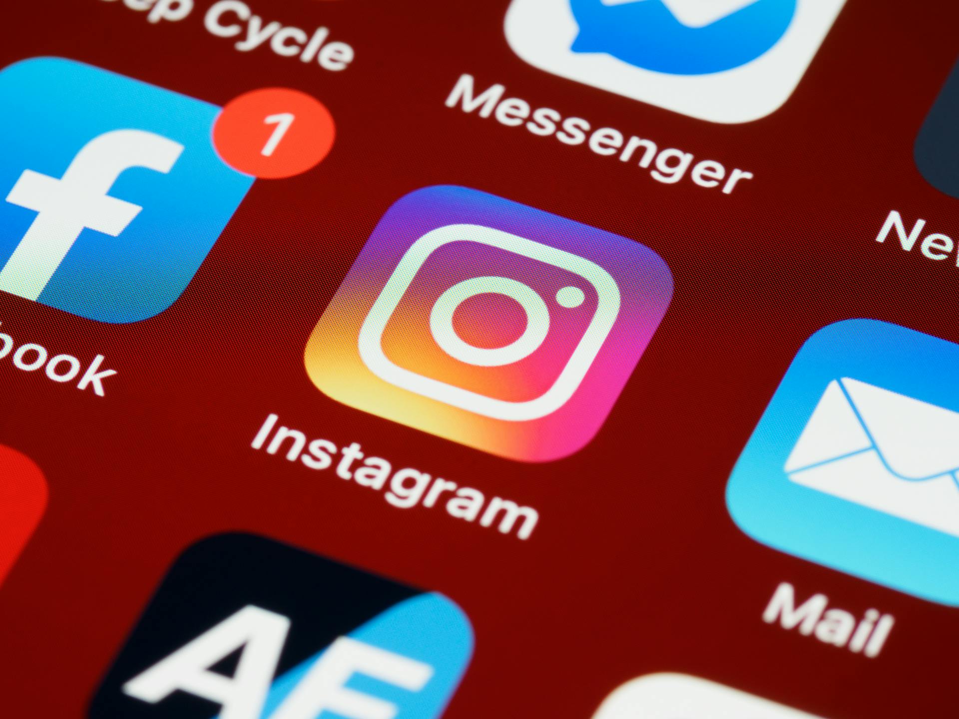 The Instagram logo on a phone screen | Source: Pexels