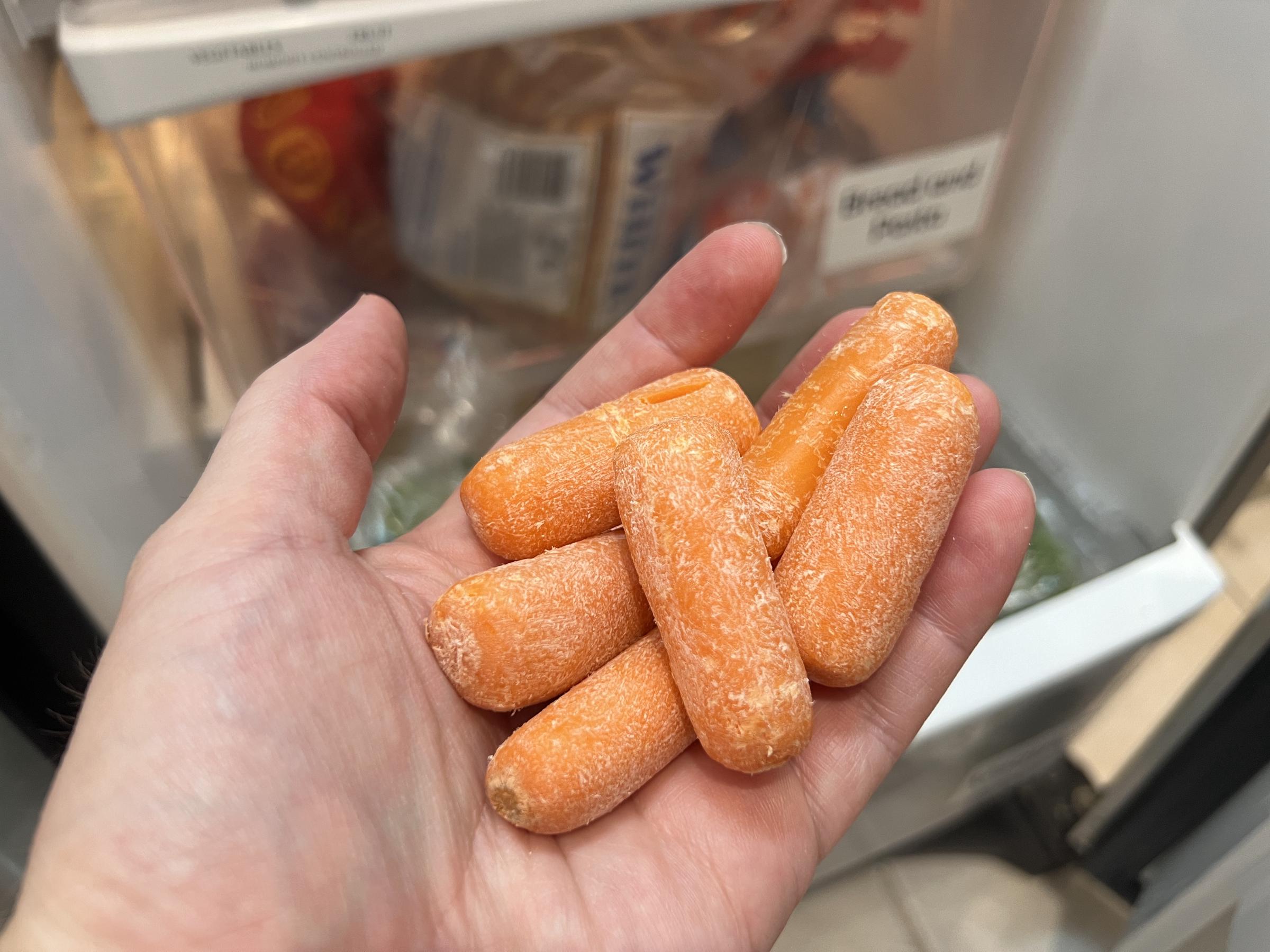 An individual holding a bunch of baby carrots in Lafayette, California. | Source: Getty Images