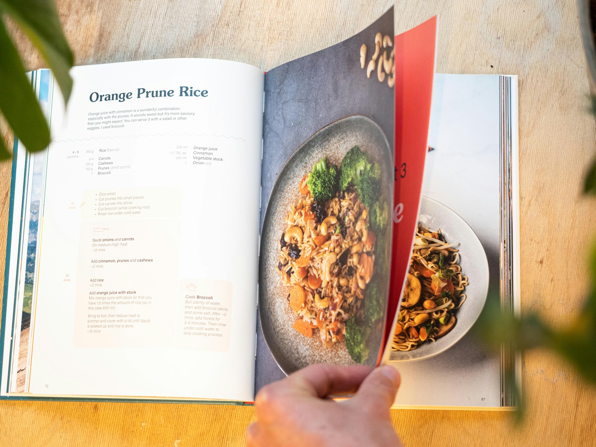 A person flipping the pages of a cookbook | Source: Unsplash