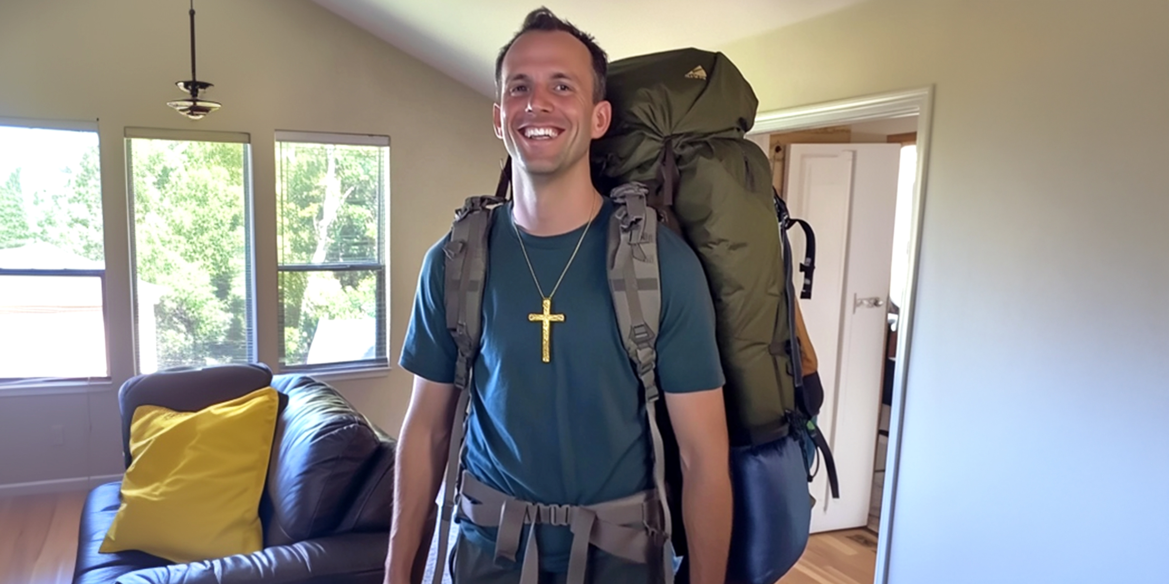 A happy man with his camping gear | Source: Amomama