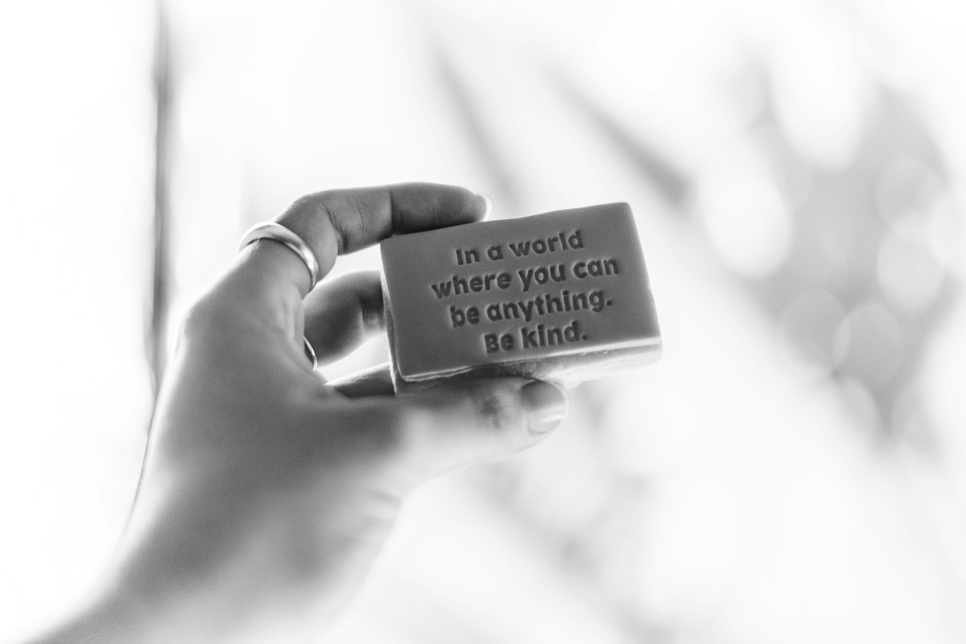 A woman bearing a powerful message in her hand | Source: Unsplash