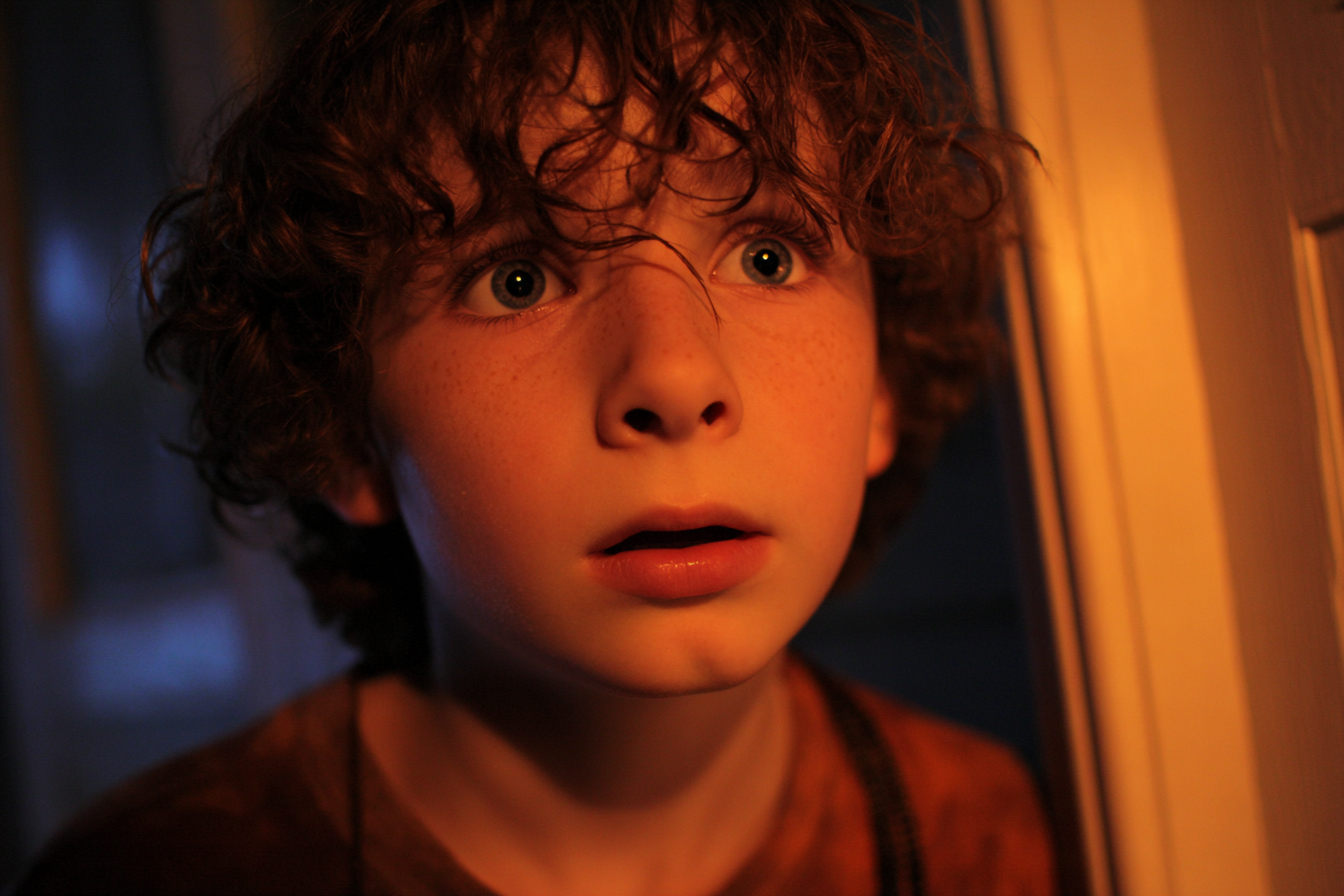 A boy staring at someone in shock | Source: Midjourney
