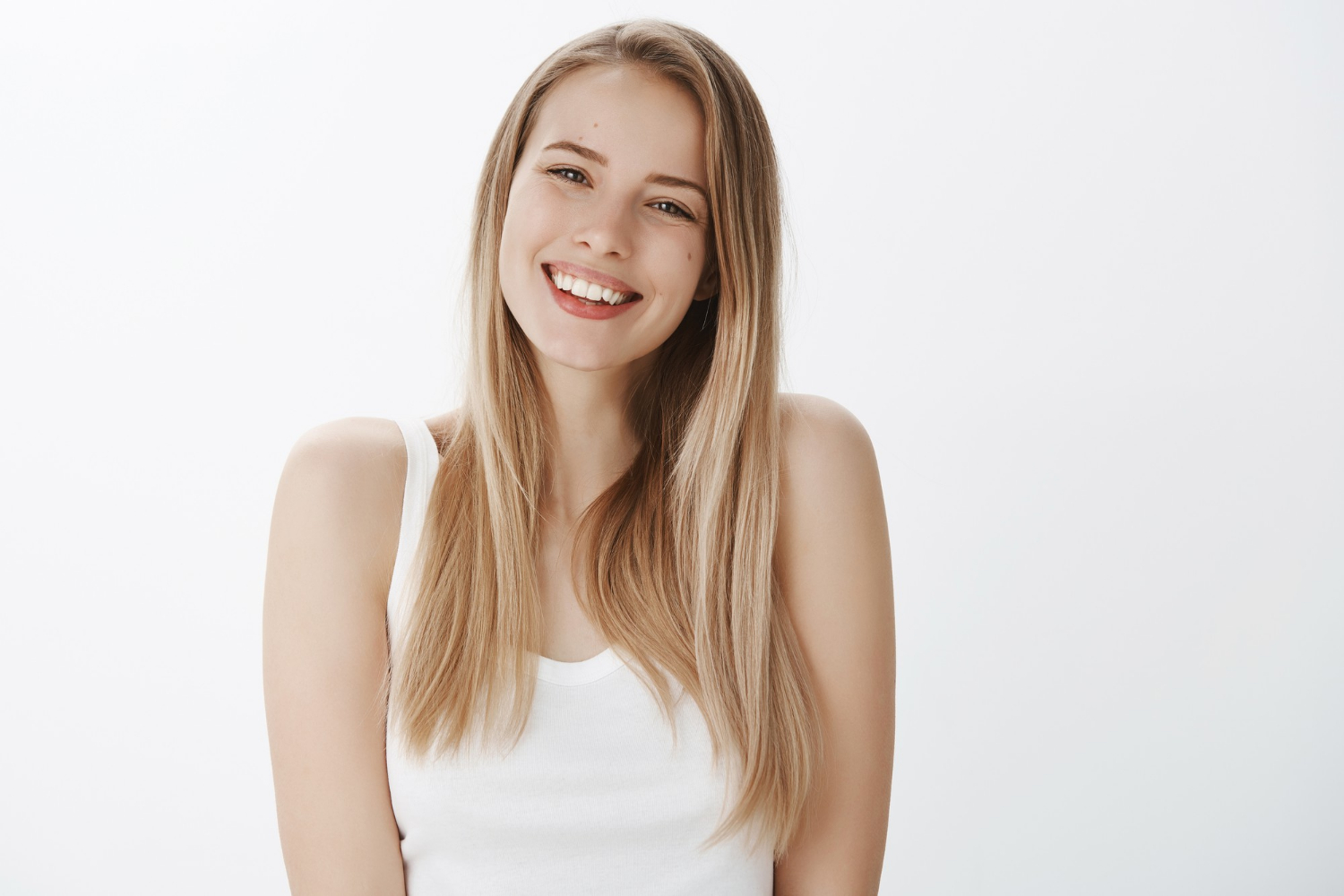 A cheerful woman with a kind smile | Source: Freepik