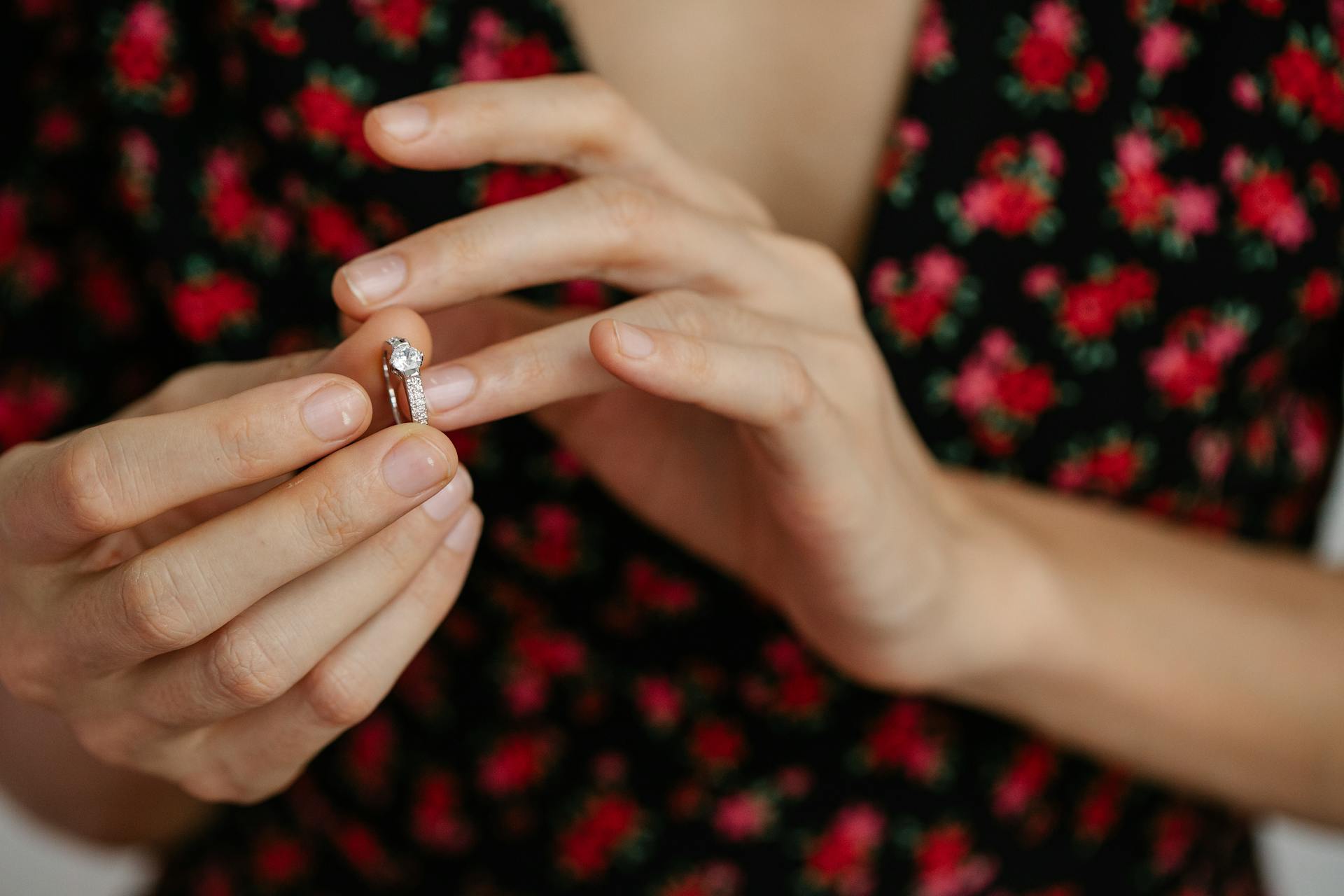 A woman putting a ring on her finger | Source: Pexels