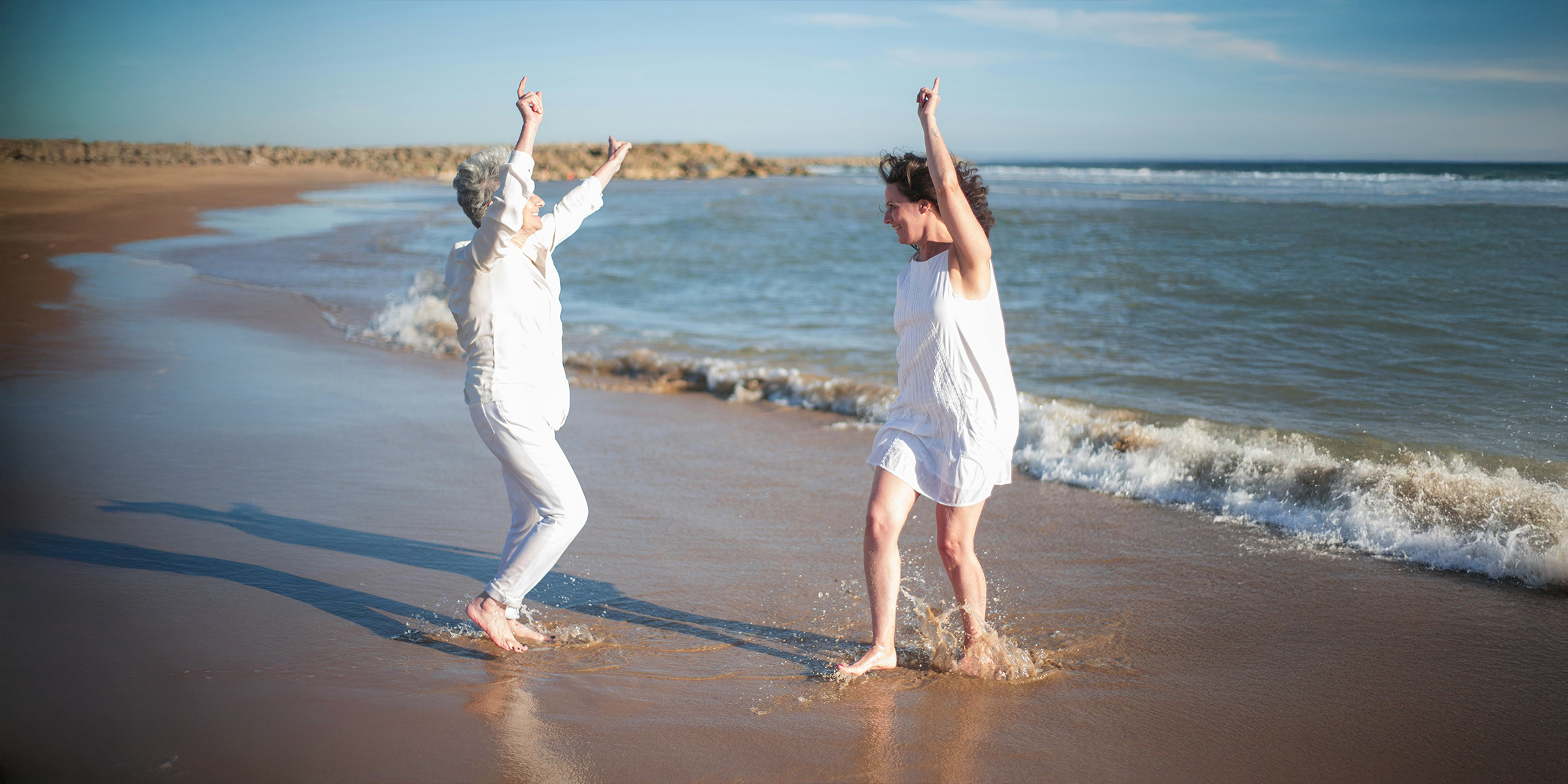 Two women dancing on the beach | Source: Pexels
