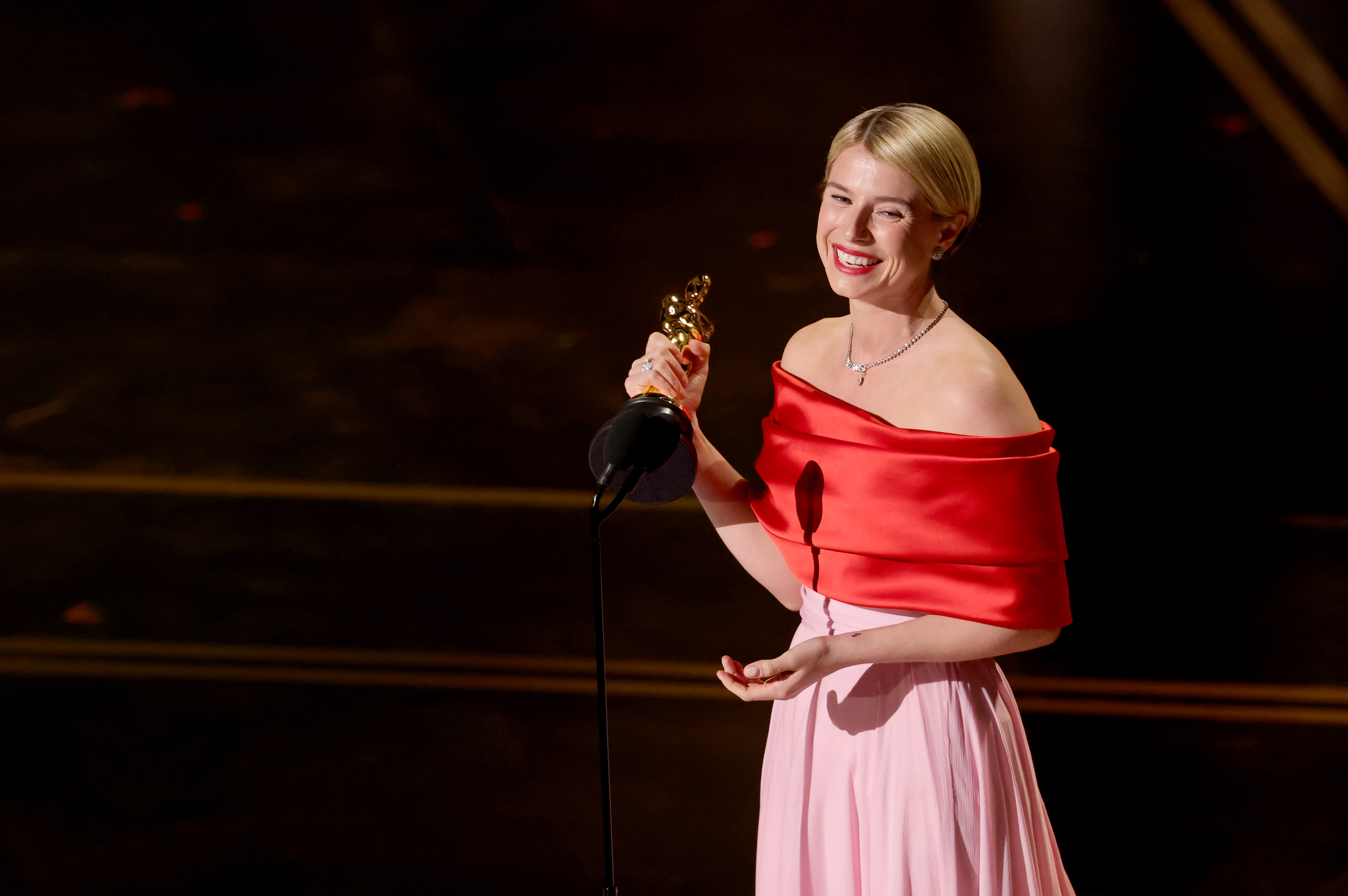 Jessie Buckley accepts her Best Actress award at the 98th Oscars at Dolby Theatre on March 15, 2026 in Hollywood, California. | Source: Getty Images