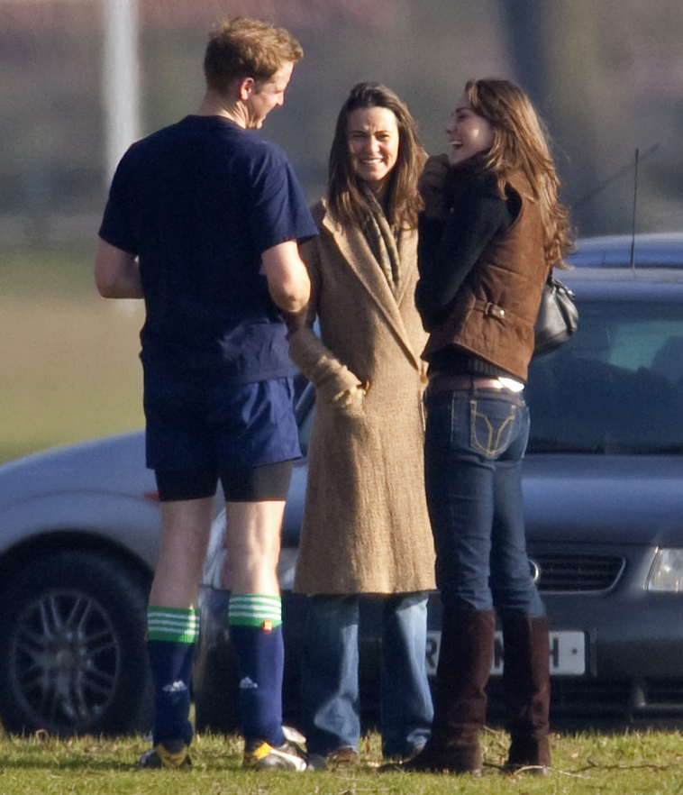 Prince William talks with Kate Middleton and her sister Pippa Middleton after playing the Field Game in an old boys match at Eton College on March 18, 2006 in Eton, England. | Source: Getty Images
