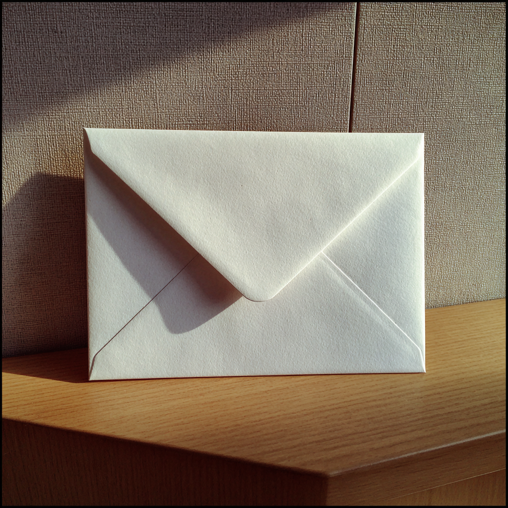 An envelope on a hallway table | Source: Midjourney