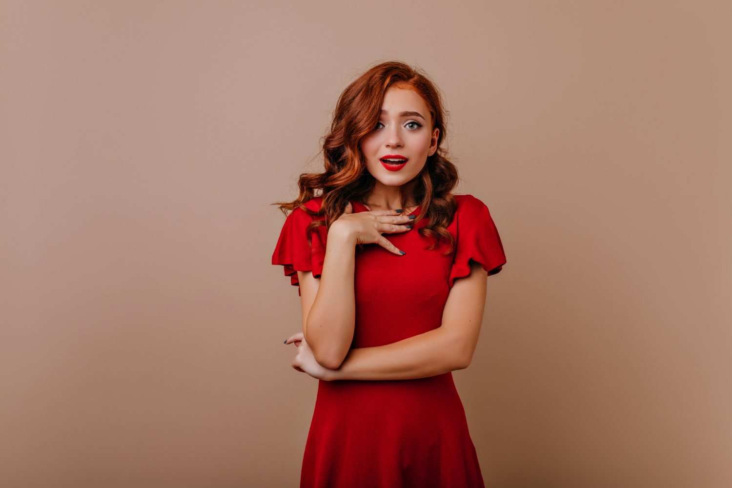 A woman in a red dress | Source: Freepik