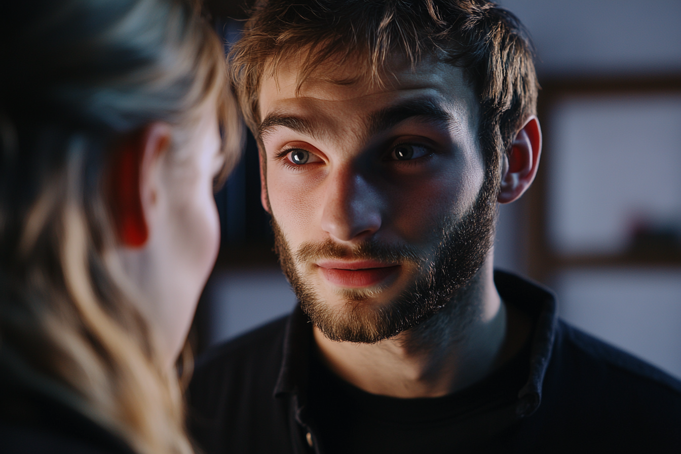 A man staring intently at a woman | Source: Midjourney