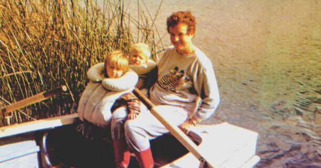 A woman with two little kids on a boat | Source: Shutterstock