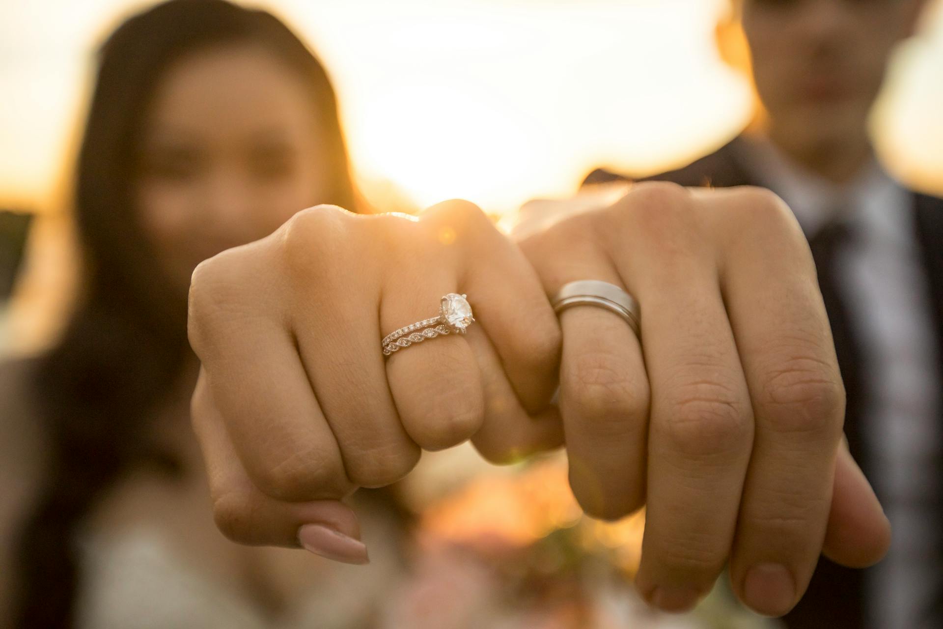 A bride and groom showing their rings | Source: Unsplash