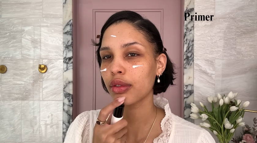 Nara Smith doing her makeup routine from a video dated December 12, 2024. | Source: YouTube/Vogue