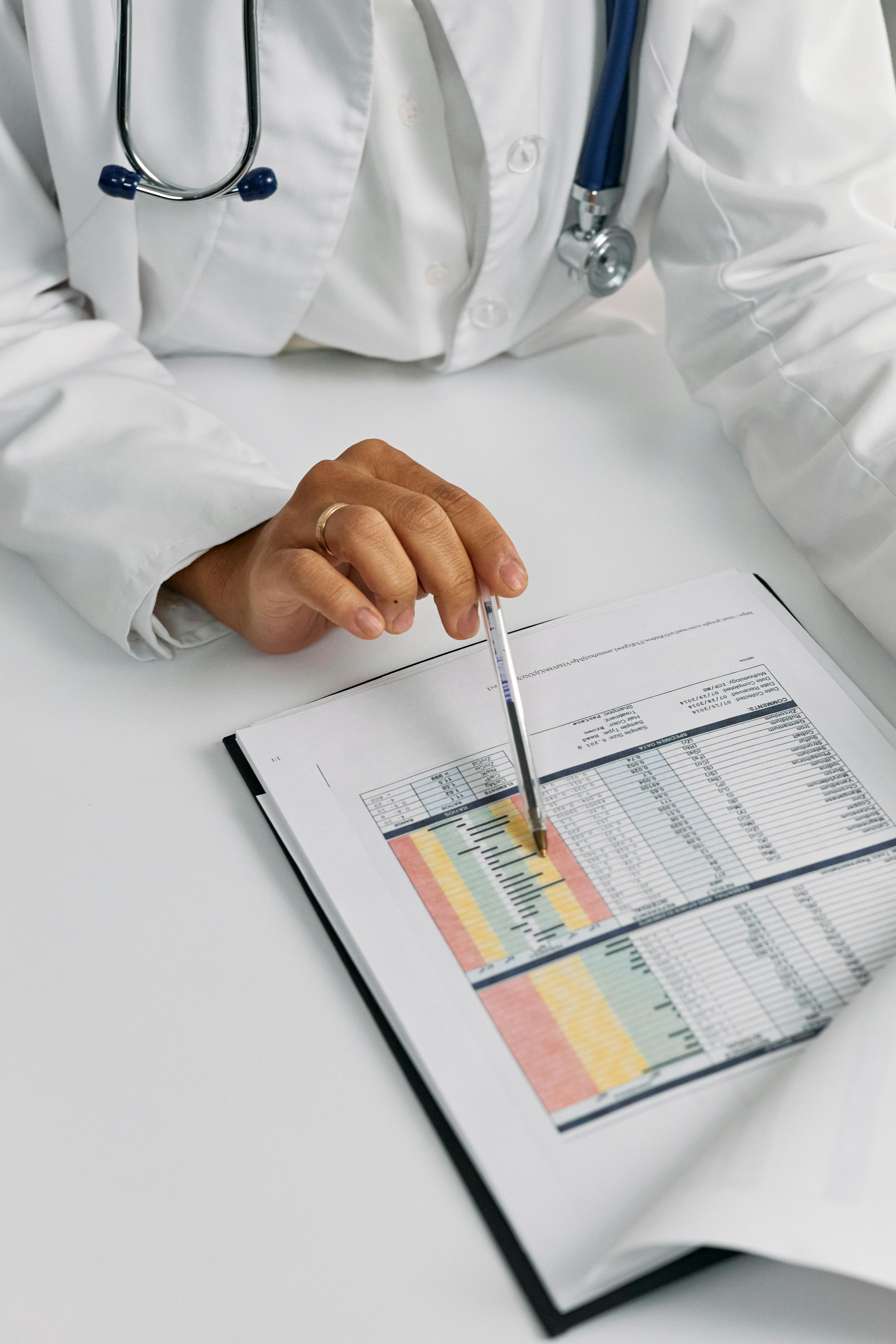 A medical professional looking at hospital records | Source: Pexels