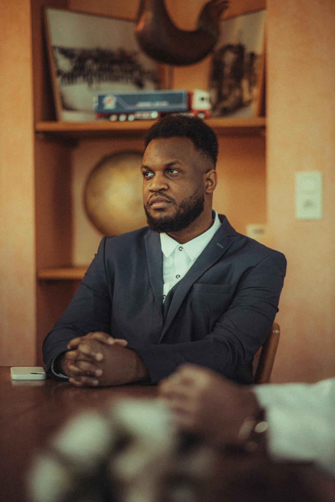 Two men seated at a table | Source: Pexels