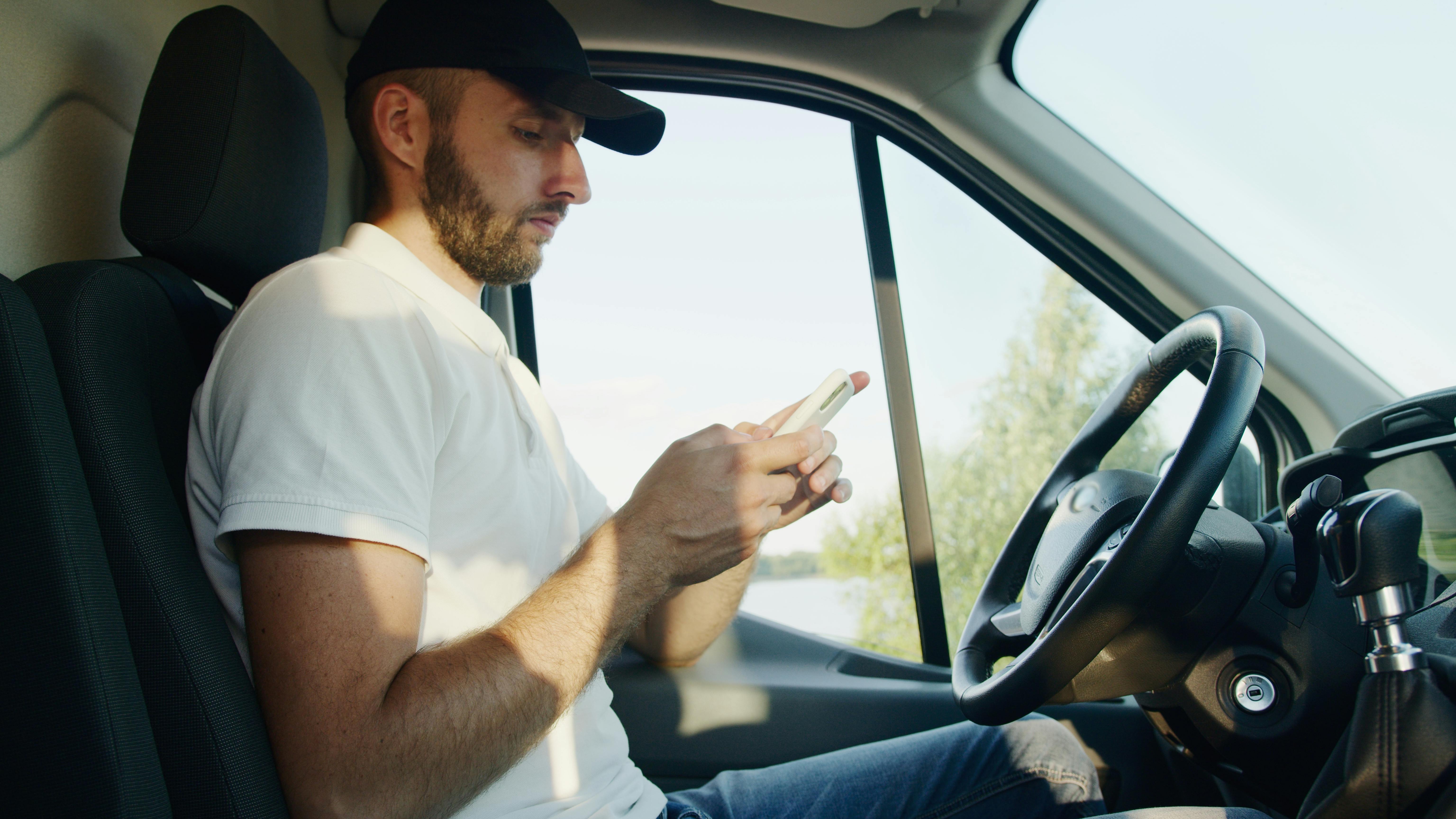 A serious man using his phone | Source: Pexels