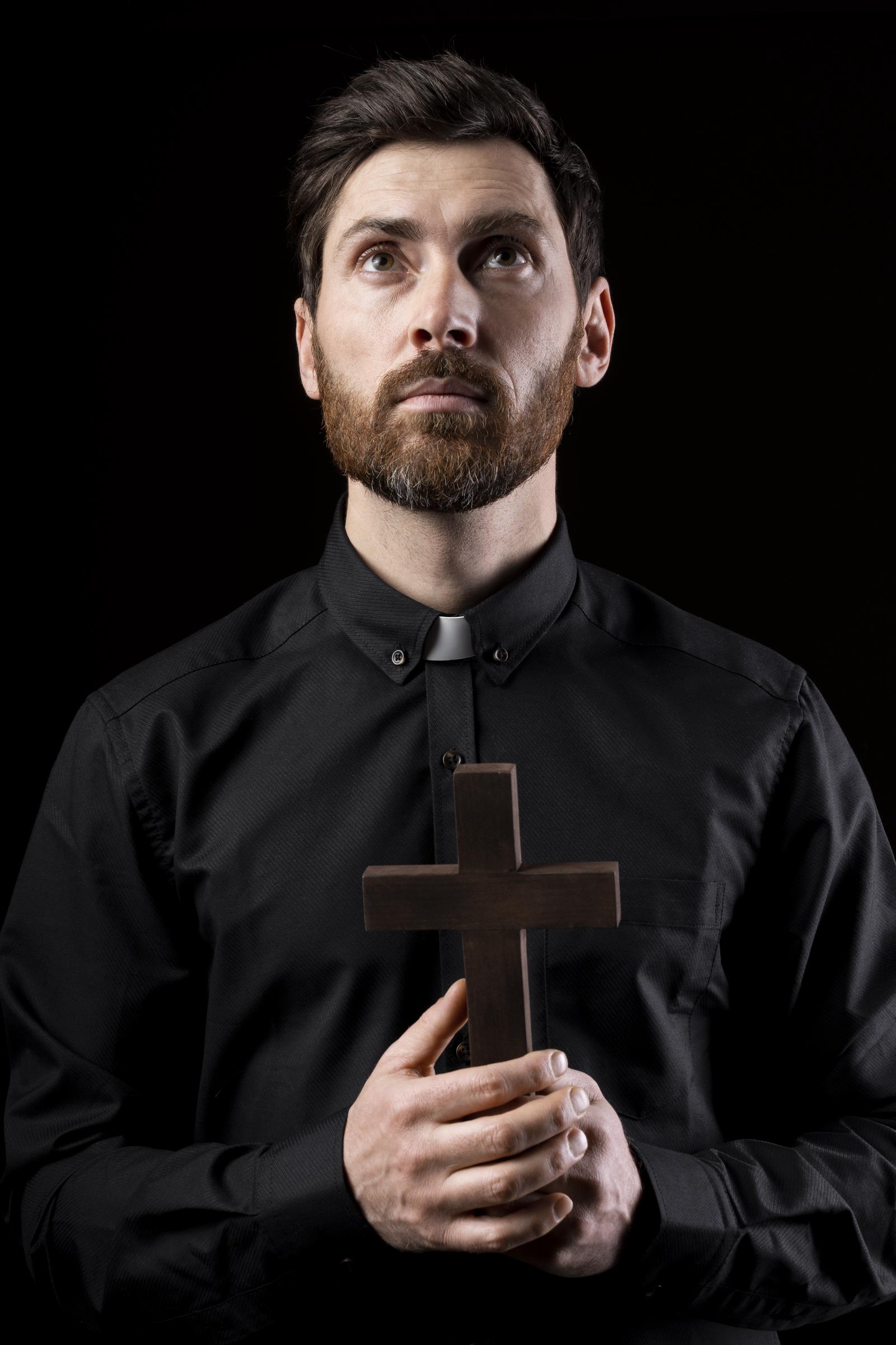 A priest with a cross | Source: Freepik