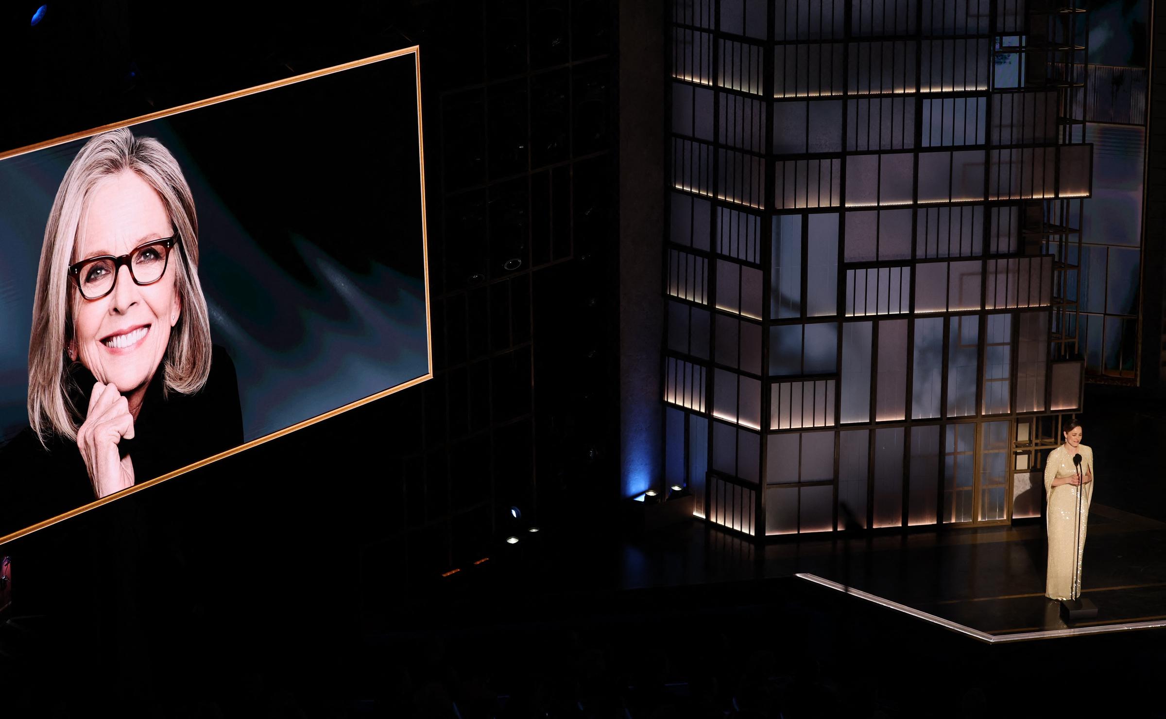 A screen shows a photo of late US actress Diane Keaton as US actress Rachel McAdams speaks during an in memoriam segment at the 98th Annual Academy Awards at the Dolby Theatre in Hollywood, California on March 15, 2026. | Source: Getty Images