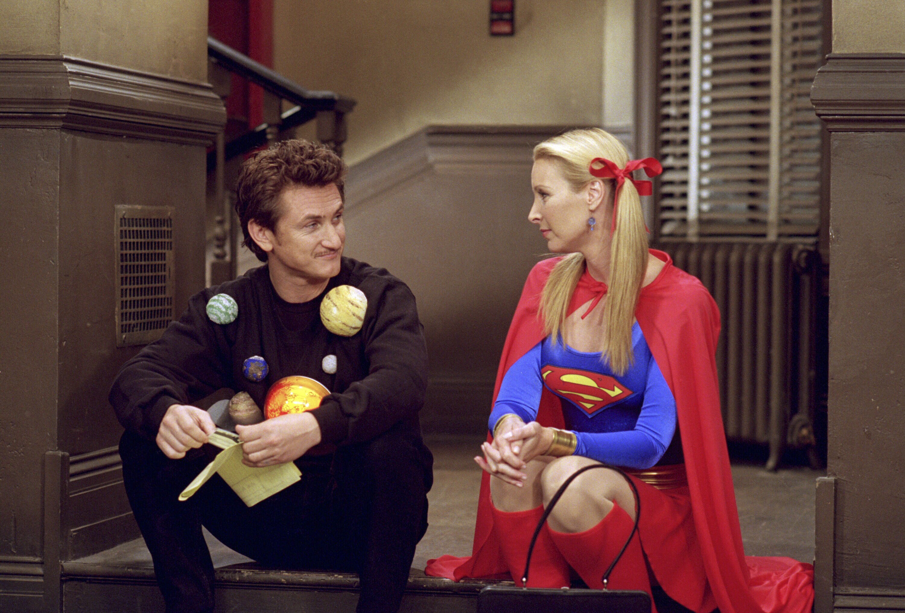 Sean Penn as Eric as "The Solar System", Lisa Kudrow as Phoebe Buffay as "Supergirl" on an episode of "FRIENDS" that aired on November 1, 2001. | Source: Getty Images
