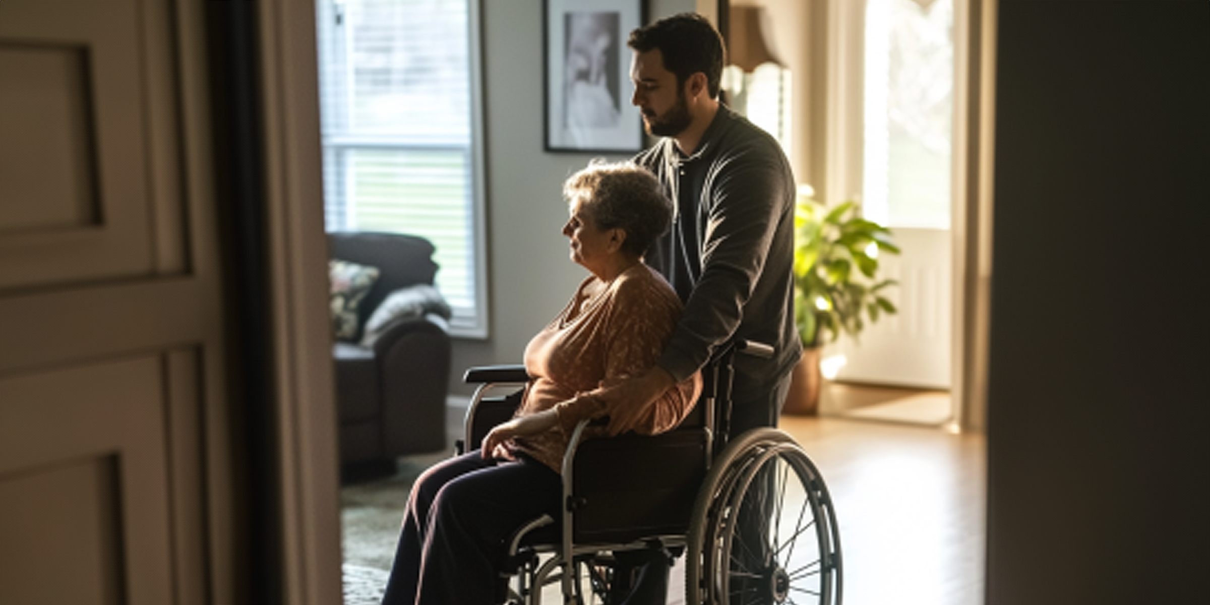 A man standing with his mother in a wheelchair | Source: Amomama