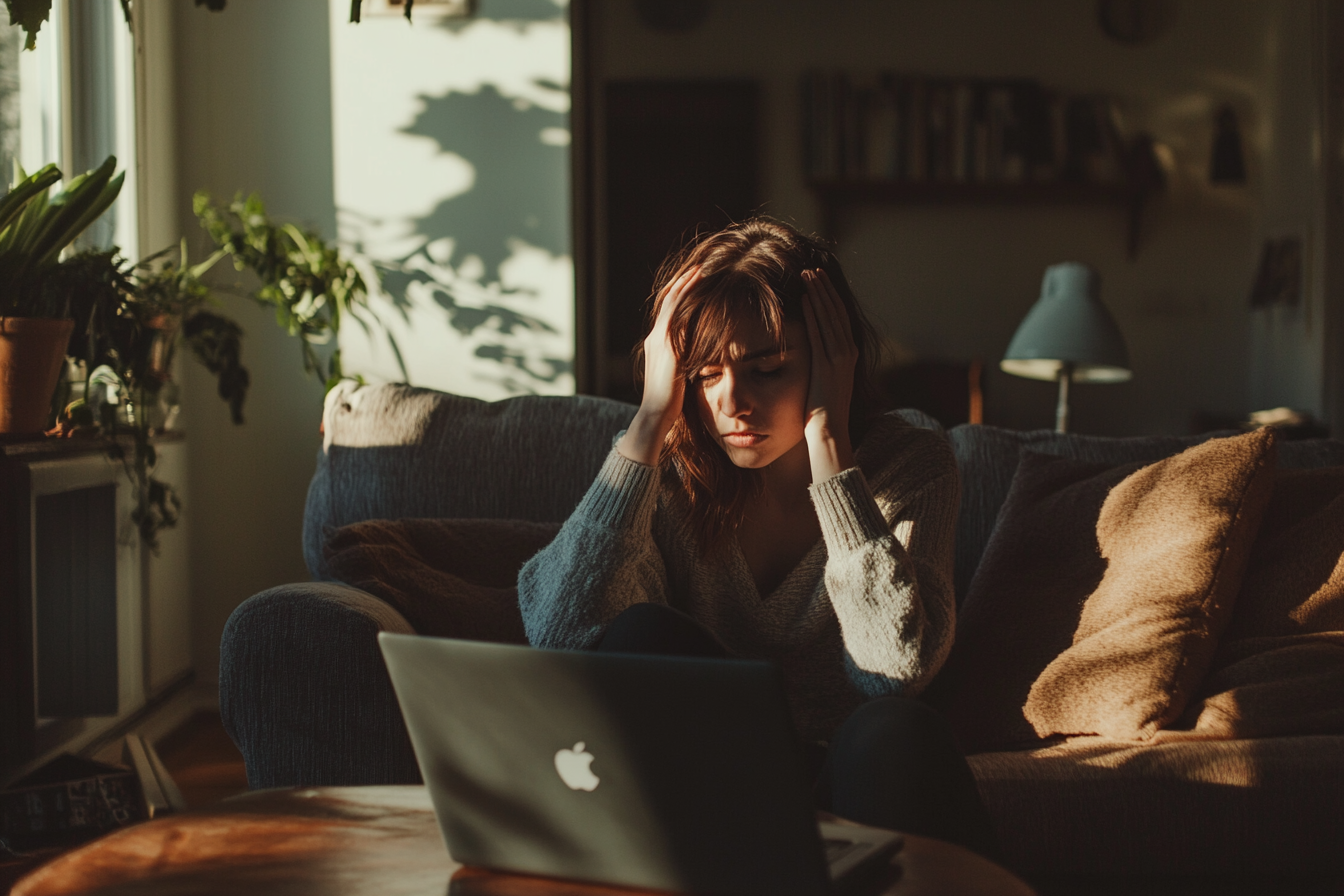 A tense woman in a living room | Source: Midjourney