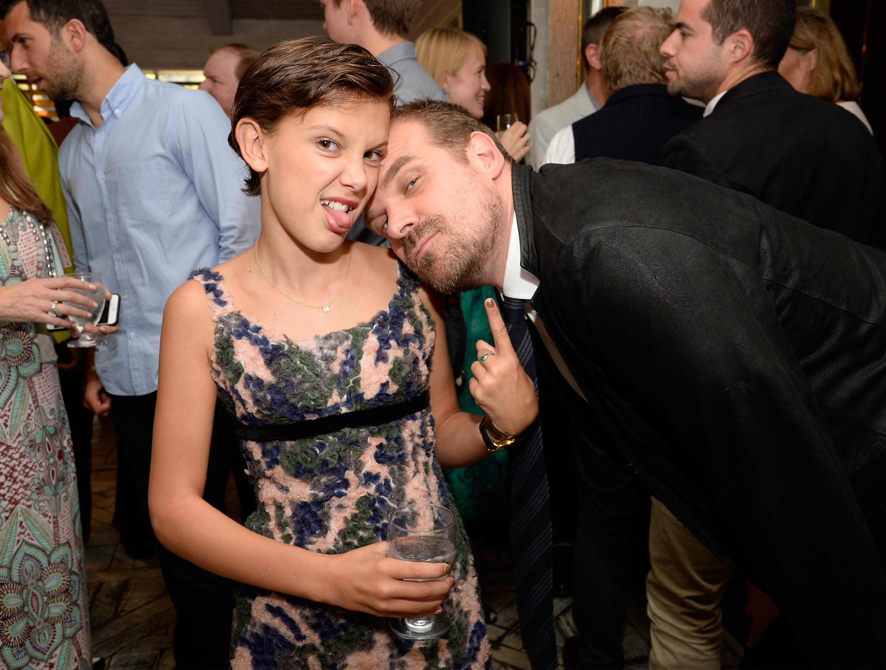 Millie Bobby Brown (L) and actor David Harbour attend the BBC America BAFTA Los Angeles TV Tea Party 2016 at The London Hotel on September 17, 2016, in West Hollywood, California. | Source: Getty Images