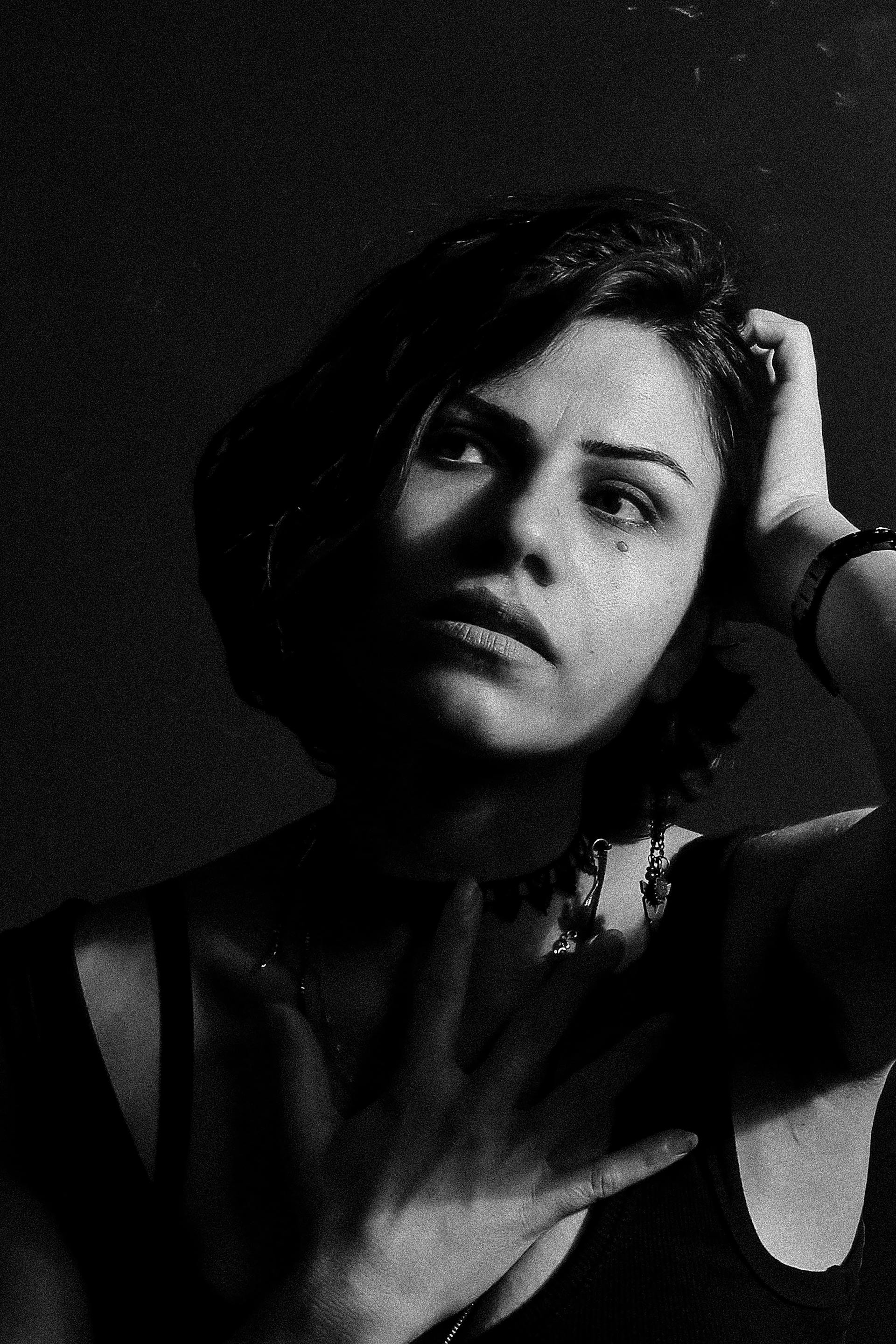 A woman staring at someone with her head tilted to one side | Source: Pexels