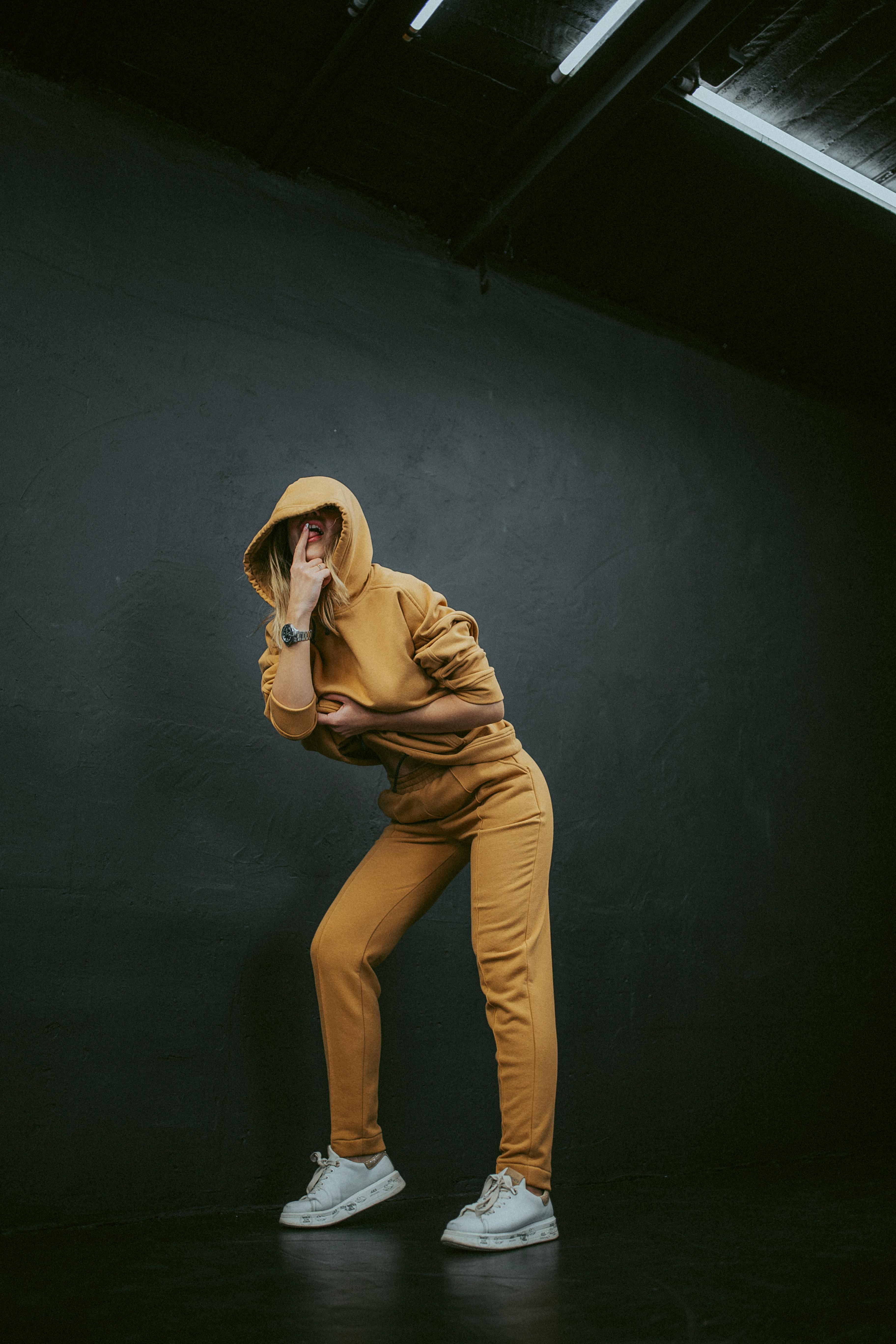 A happy woman in a tracksuit | Source: Pexels