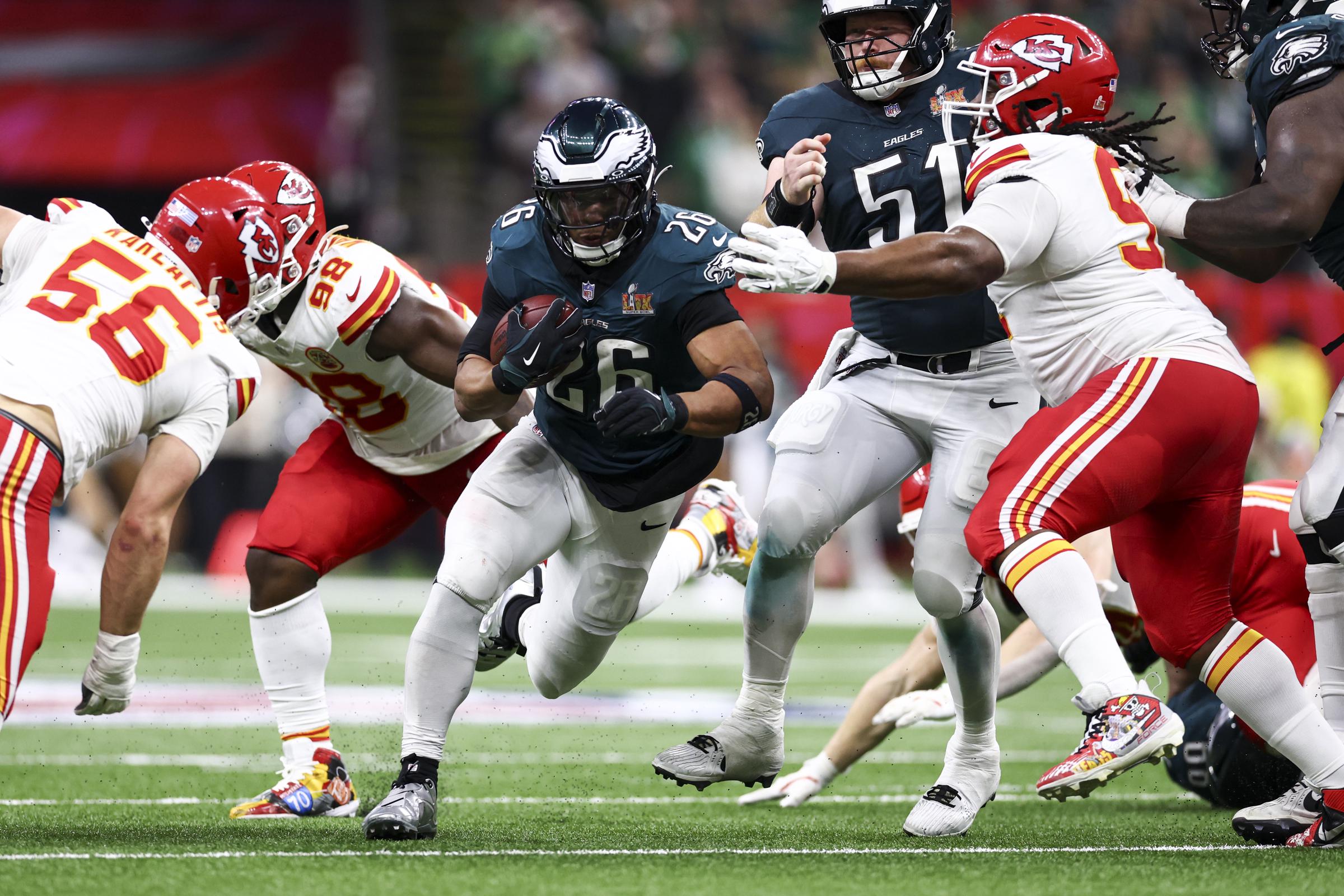 Saquon Barkley of the Philadelphia Eagles carrying the ball against the Kansas City Chiefs in the second half of Super Bowl LIX on February 9, 2025. | Source: Getty Images