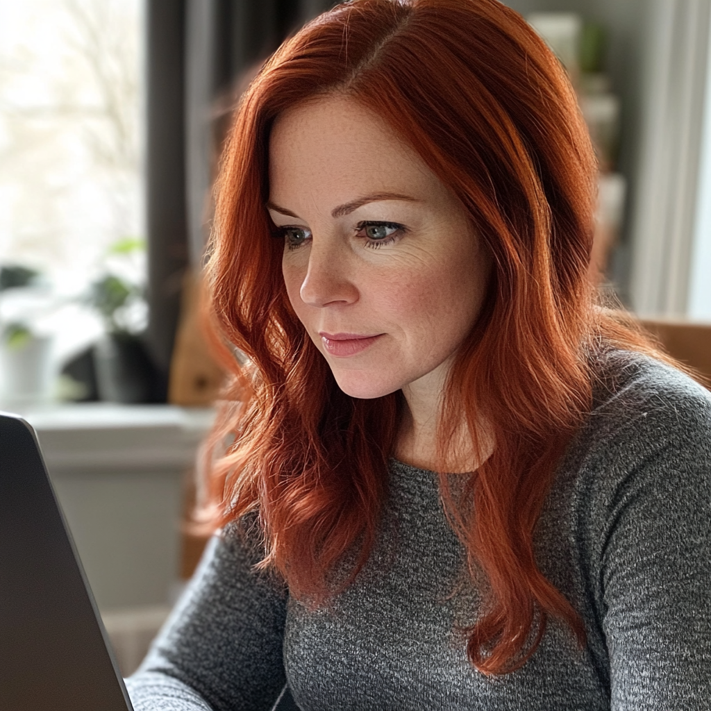 A woman using a laptop | Source: Midjourney