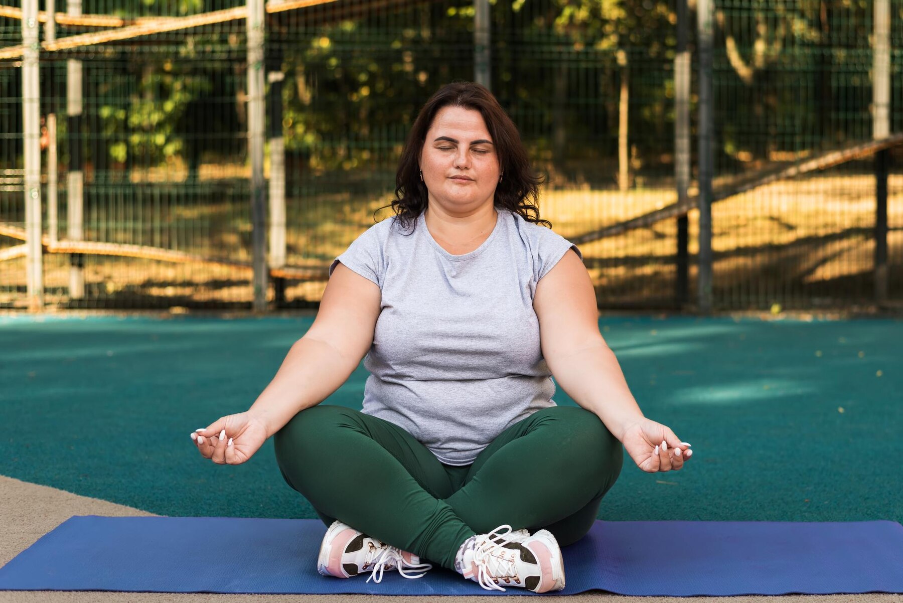 A woman in a yoga class | Source: Freepik