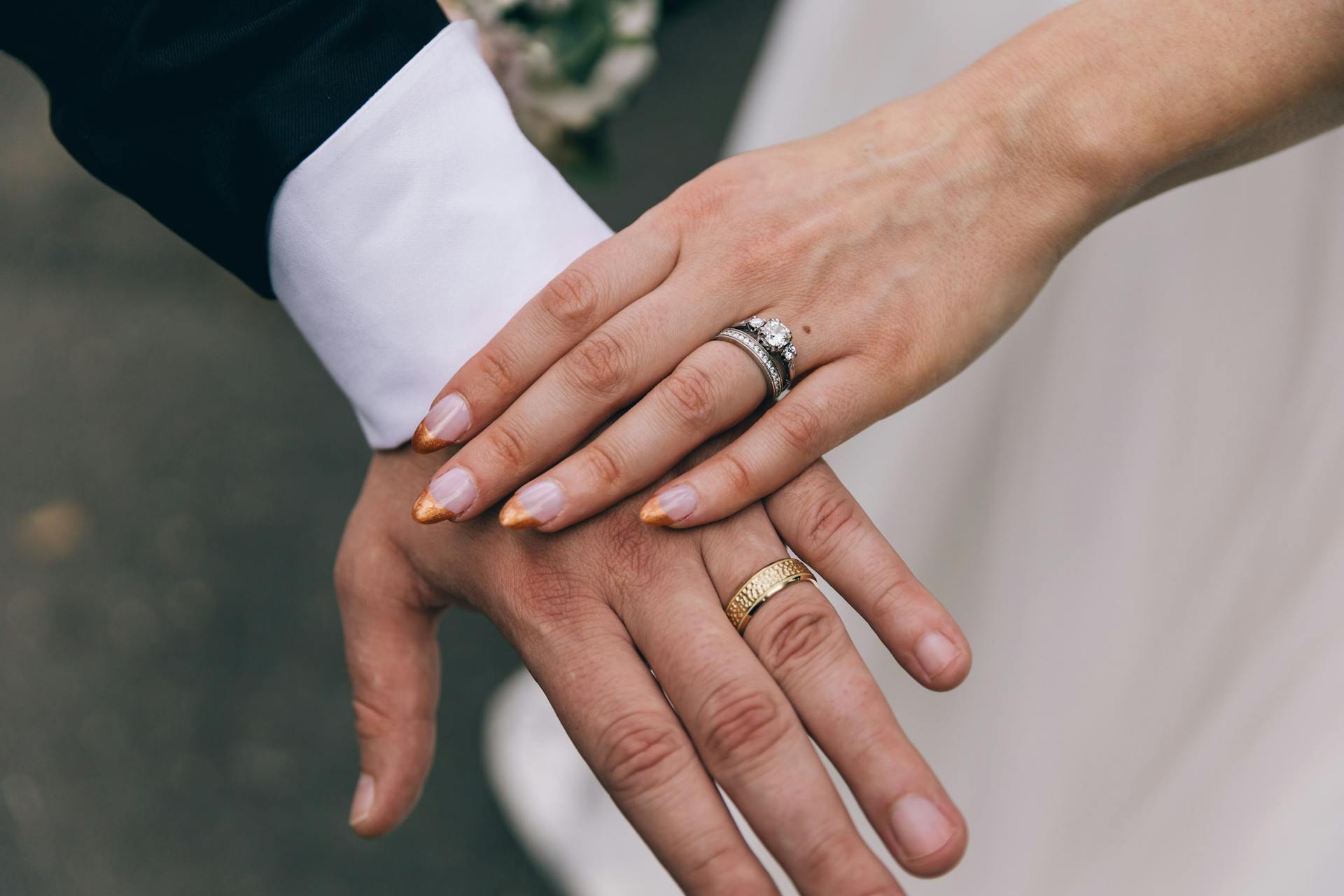 A couple showing their rings | Source: Pexels