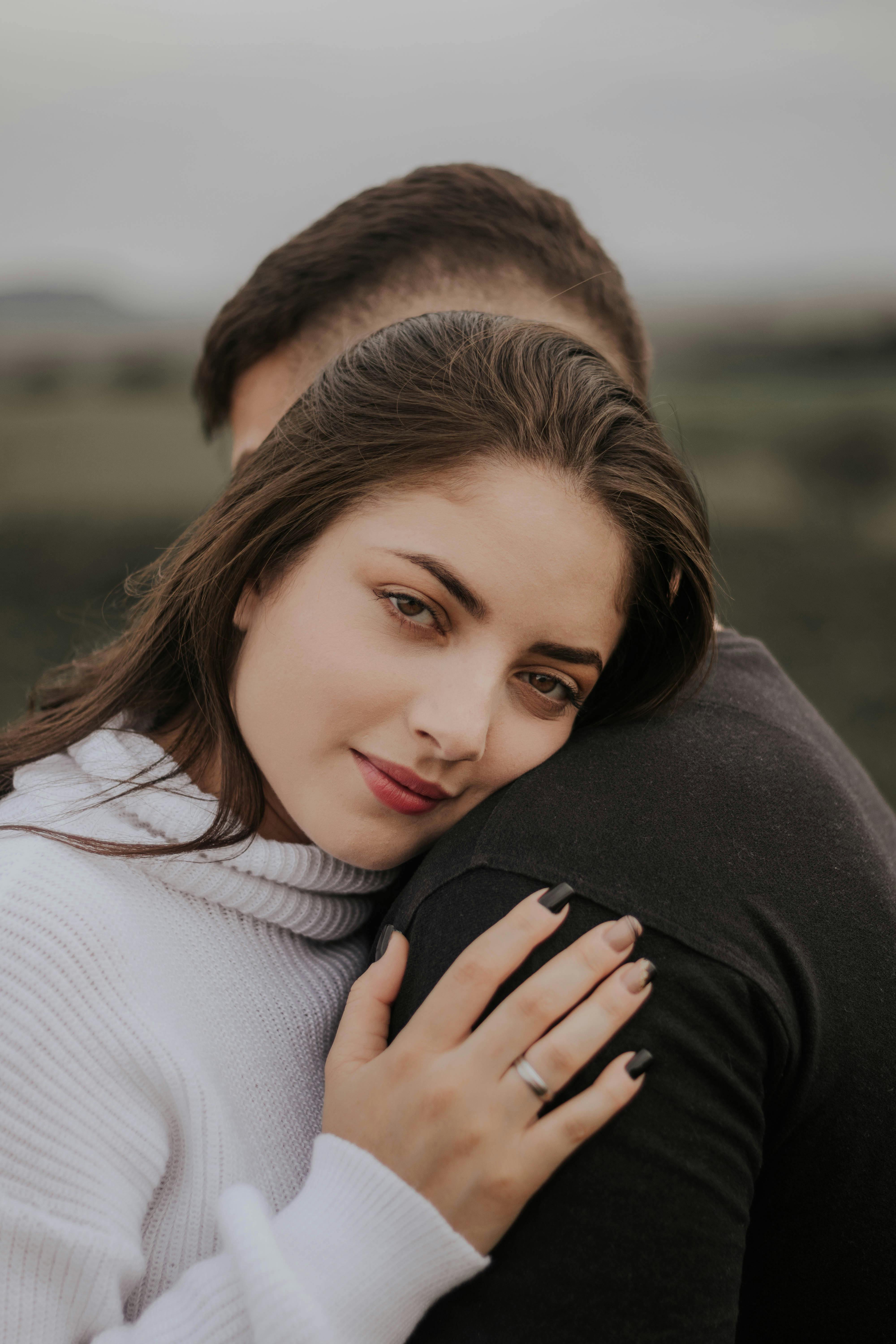 A woman getting a hug from a man | Source: Pexels