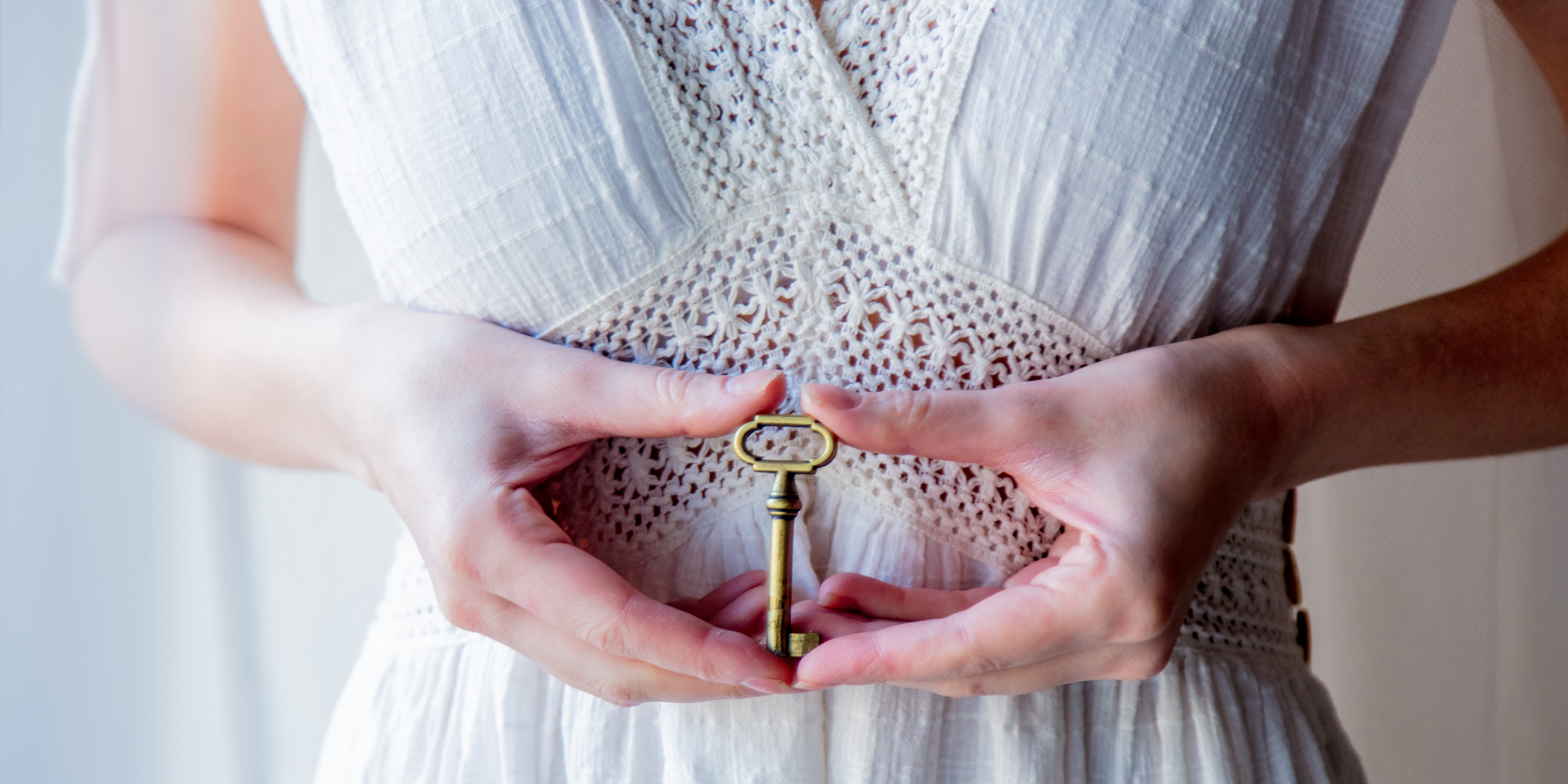 Woman holding an old key in her hands | Source: Shutterstock