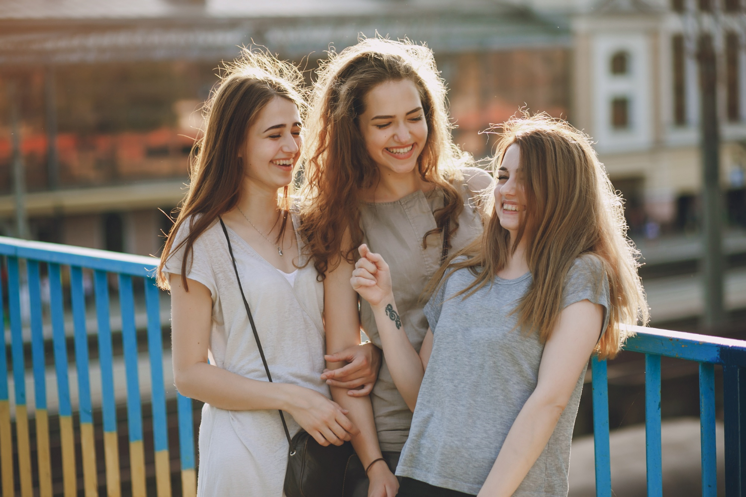 Three cheerful young girls | Source: Freepik