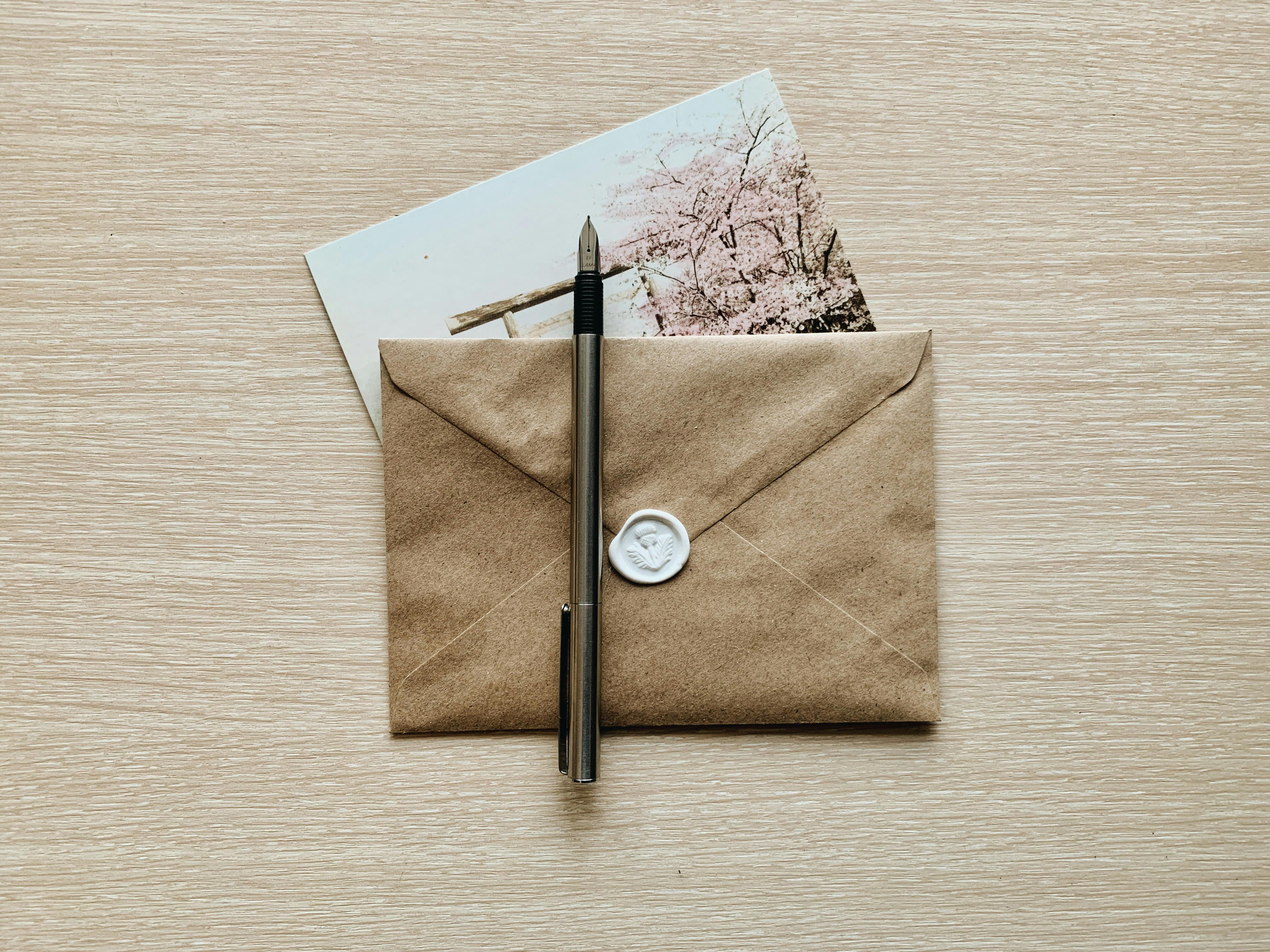 Fountain pen on a sealed envelope | Source: Pexels