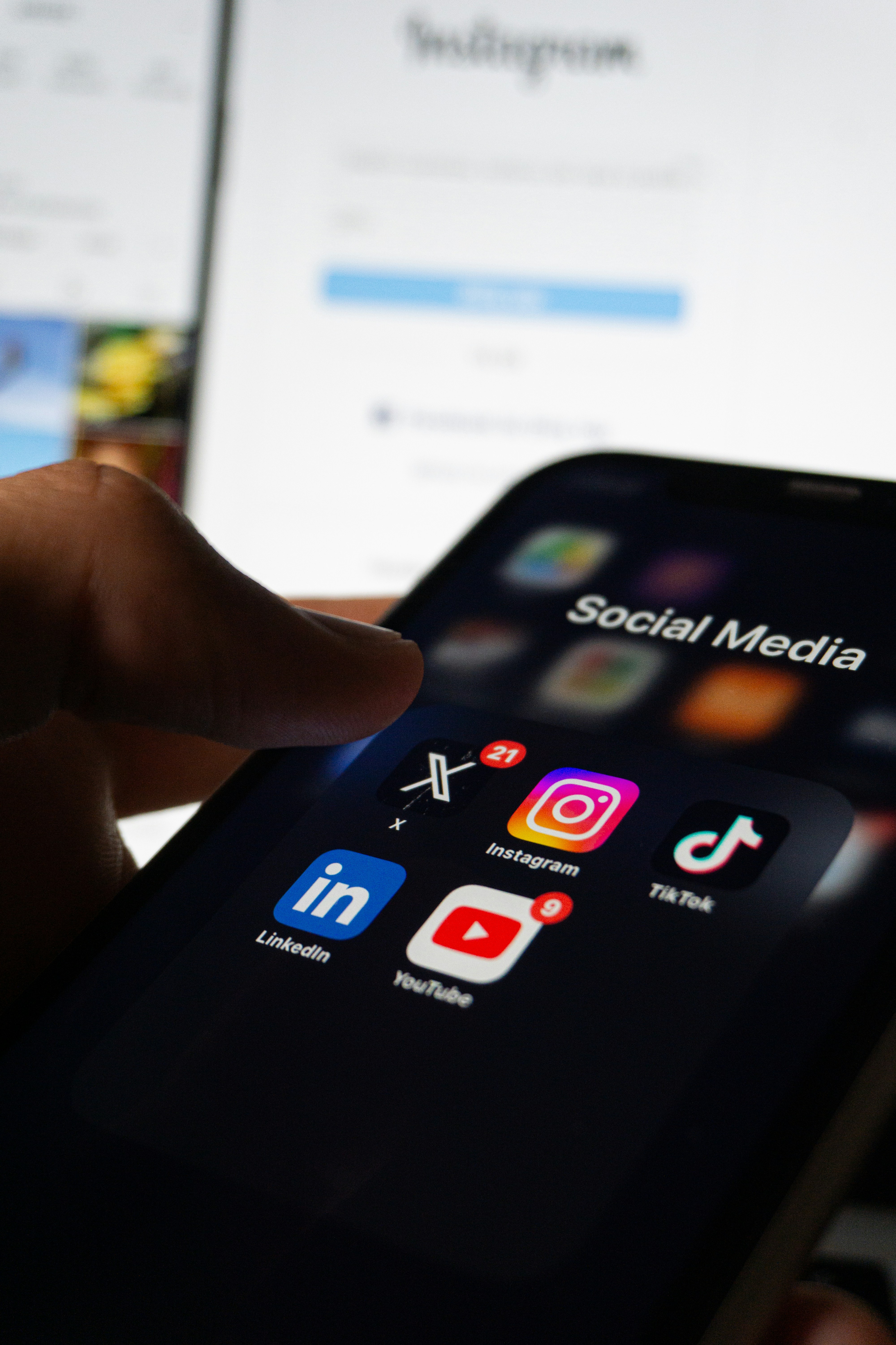 A person holding a phone open to social media | Source: Unsplash