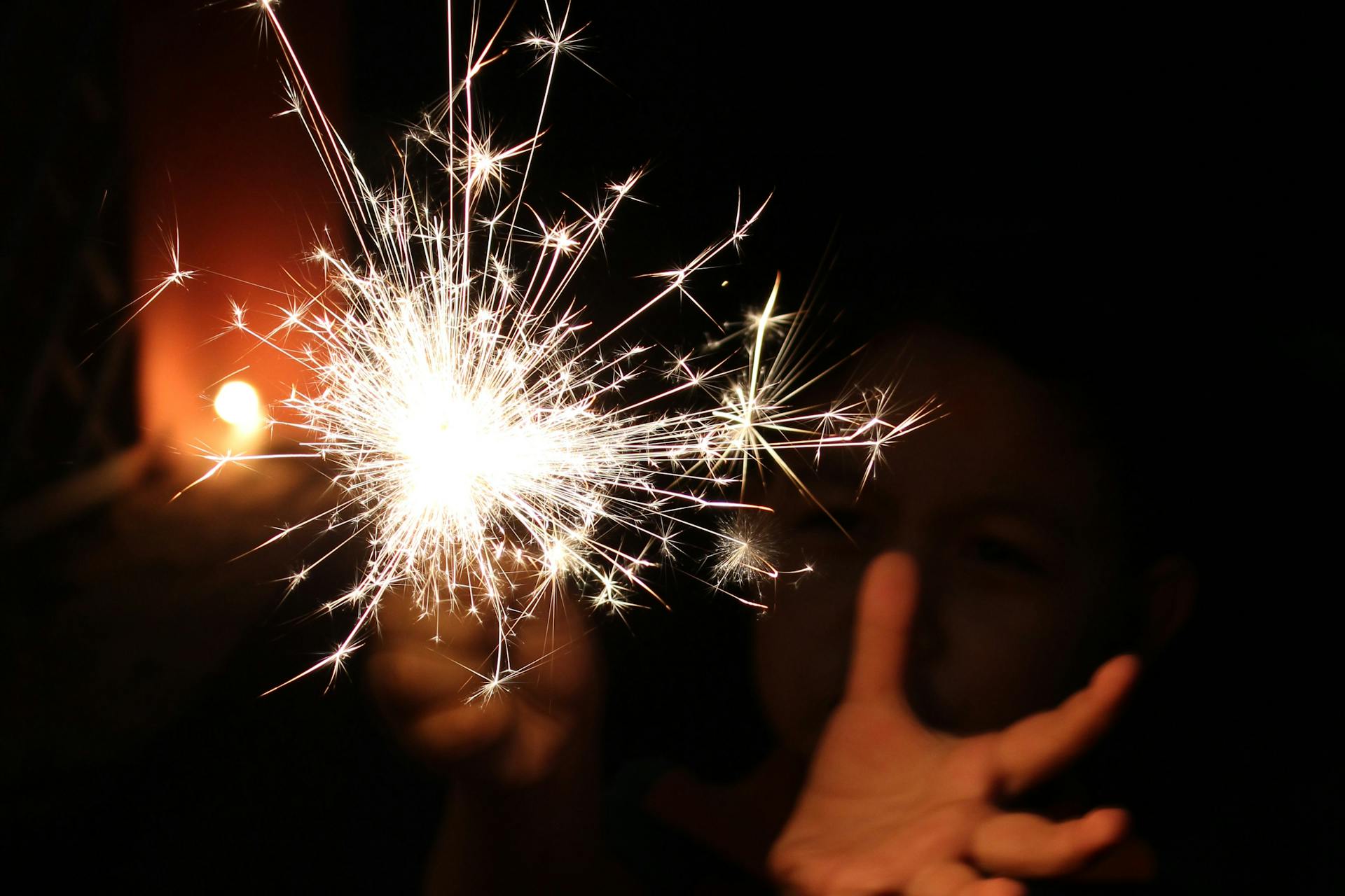 A close-up shot of a person holding a sparkler | Source: Pexels