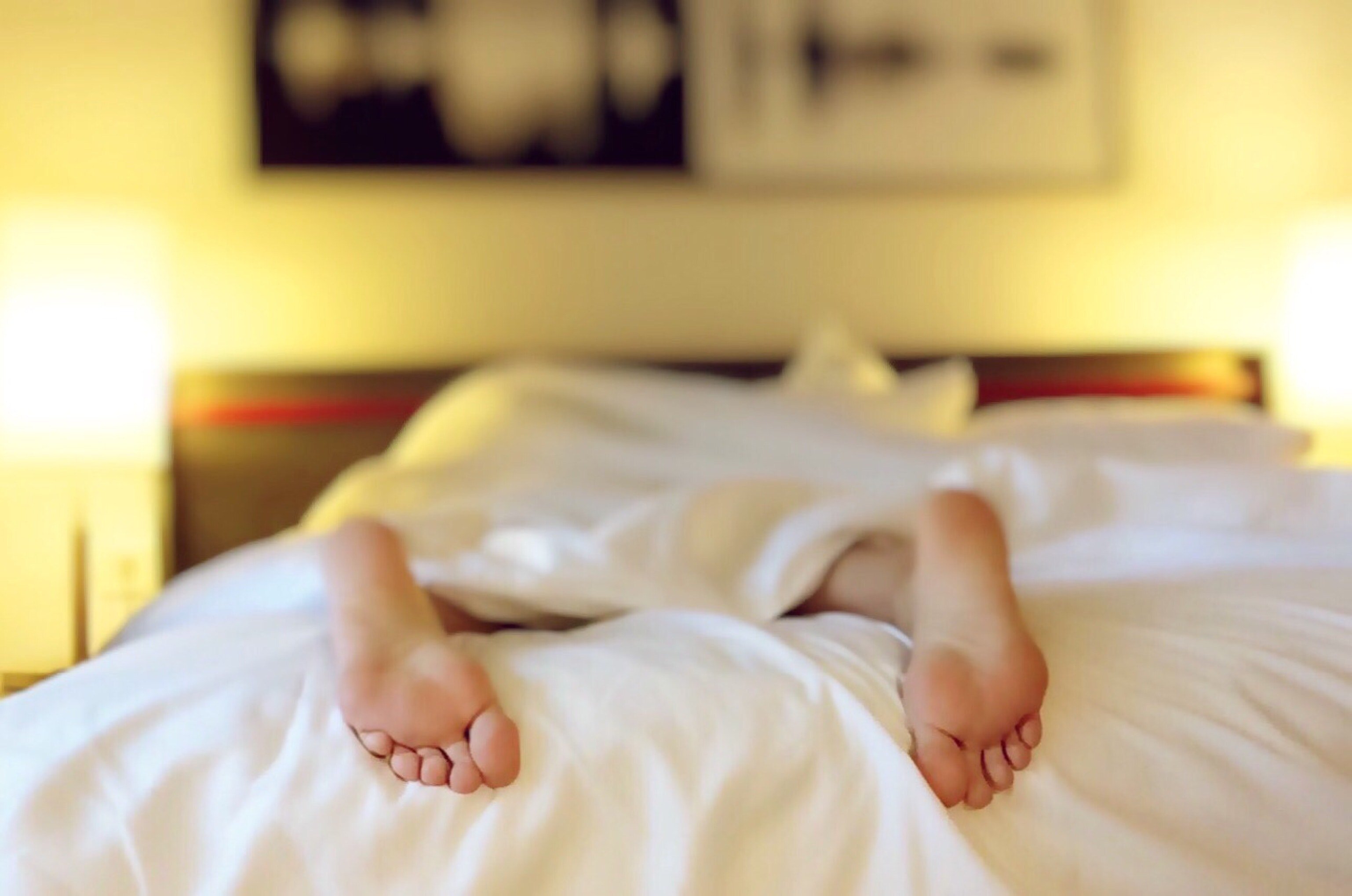 Someone laying on a bed | Source: Pexels